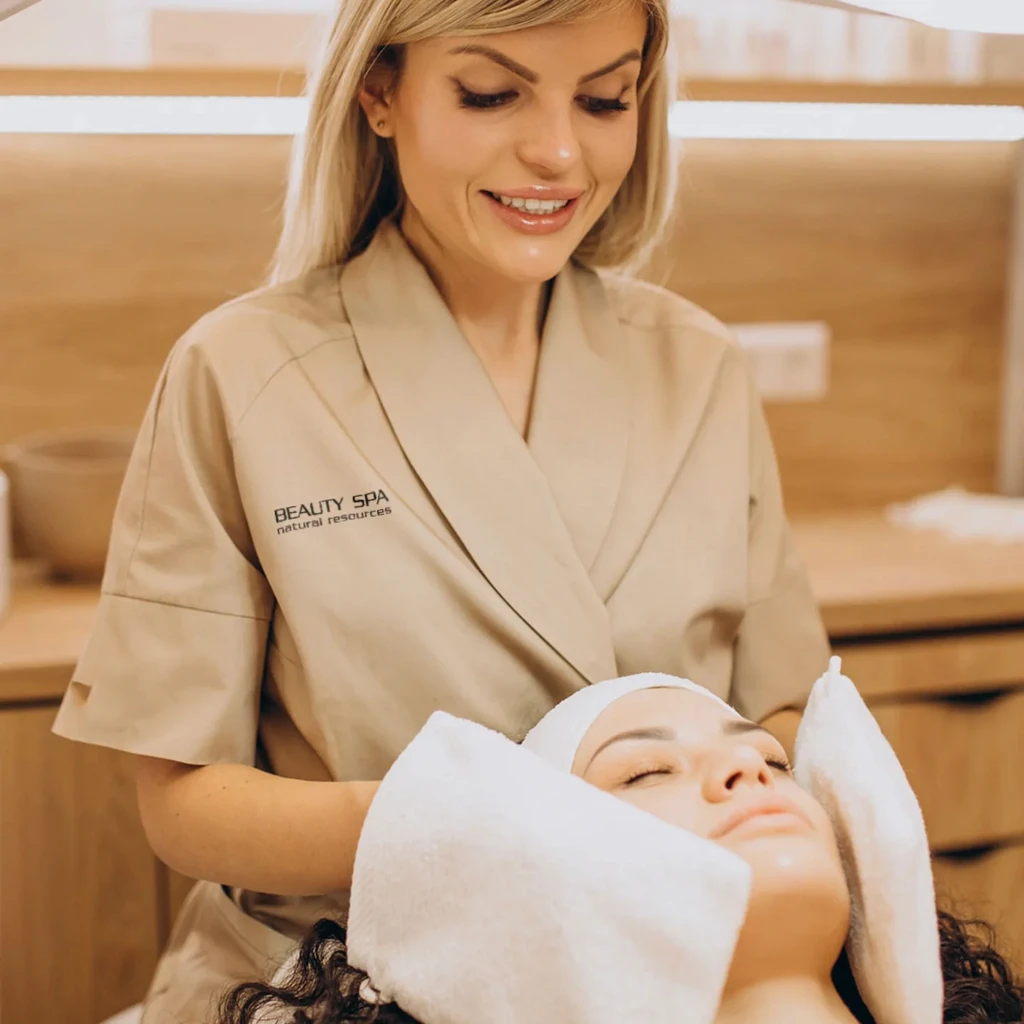 Therapist using herbal compress on back