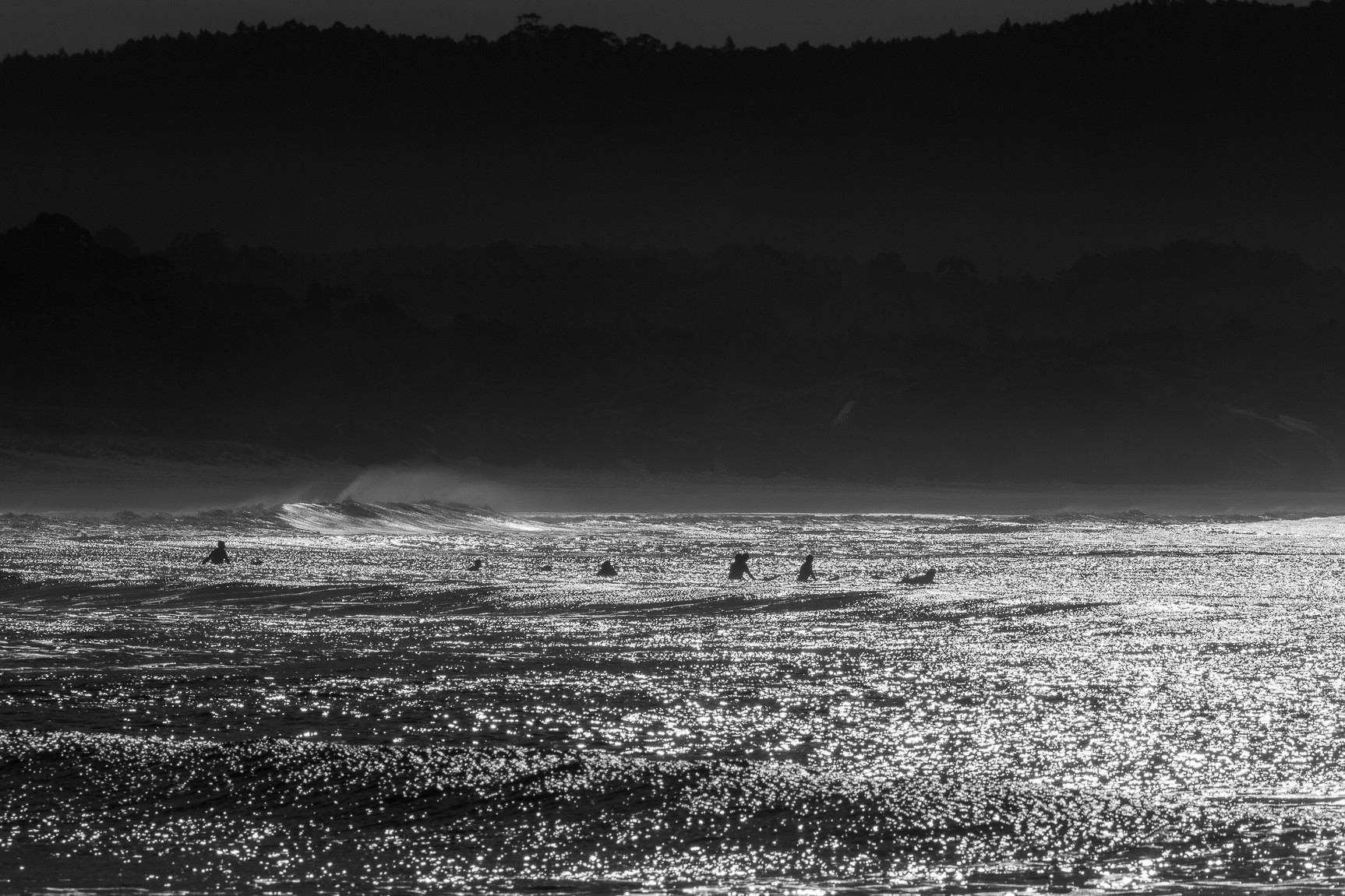 Black and white photography of surfer's line-up