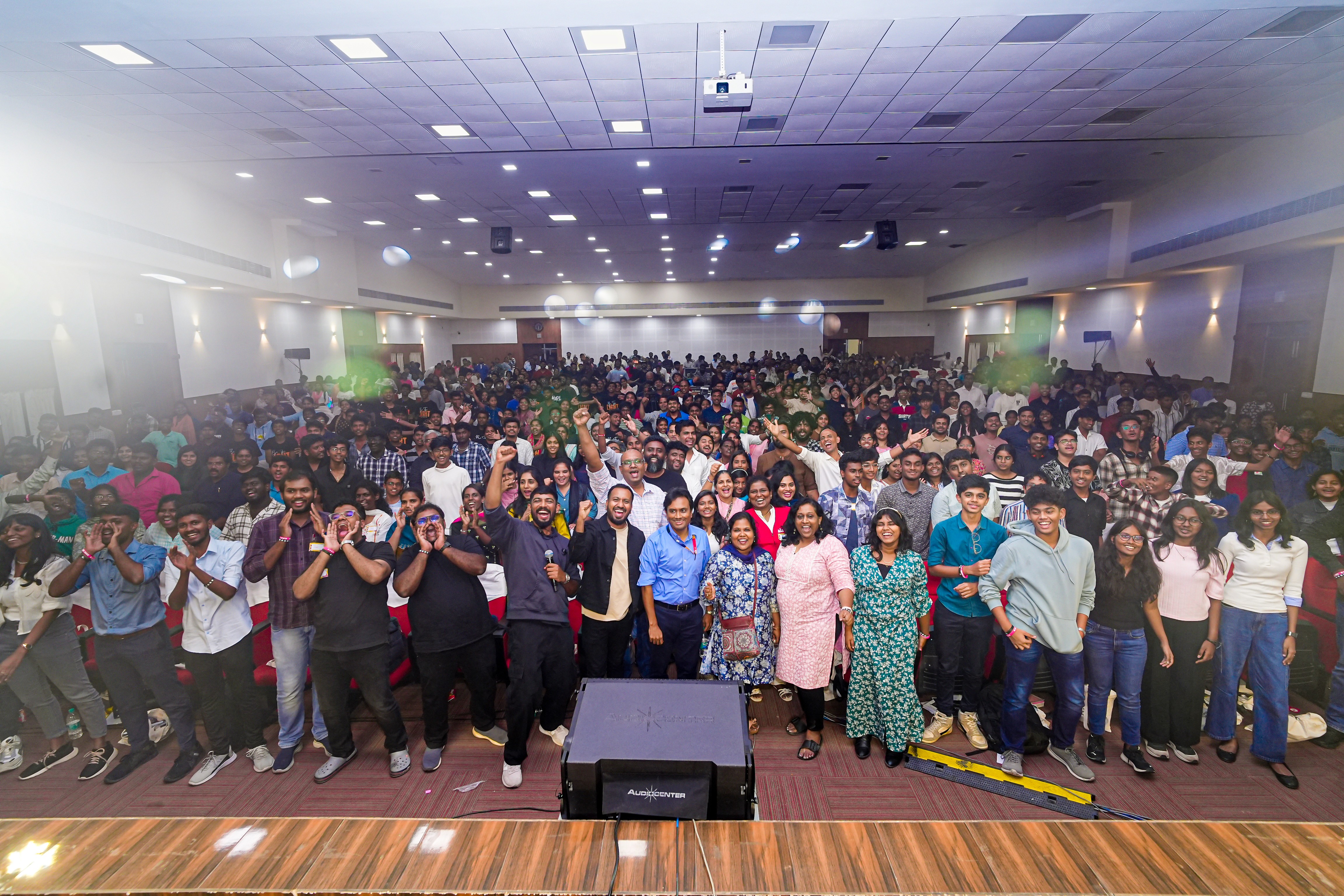 A congregation gathered inside a large hall.