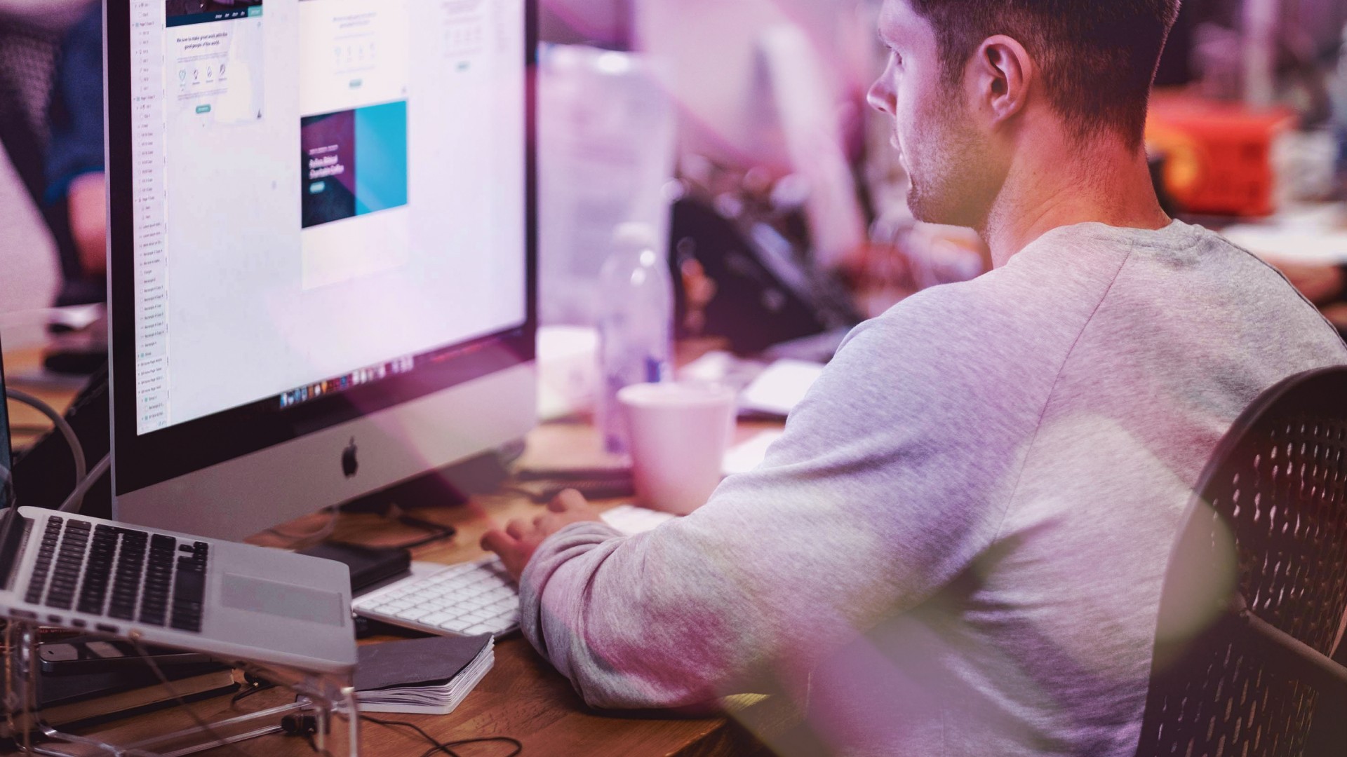 A man does design work at his work station