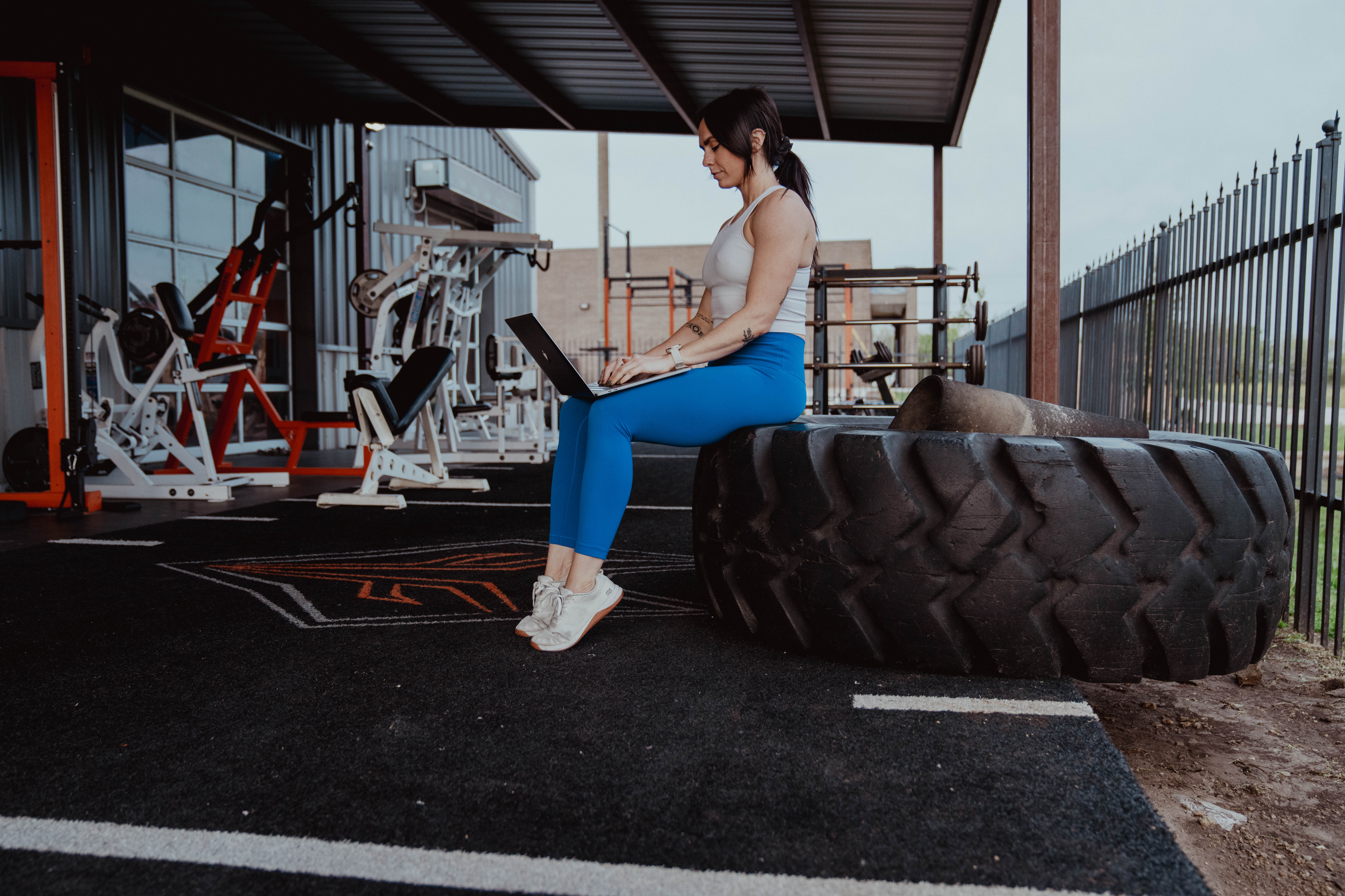woman sitting on tire - How to Work Out When Tired