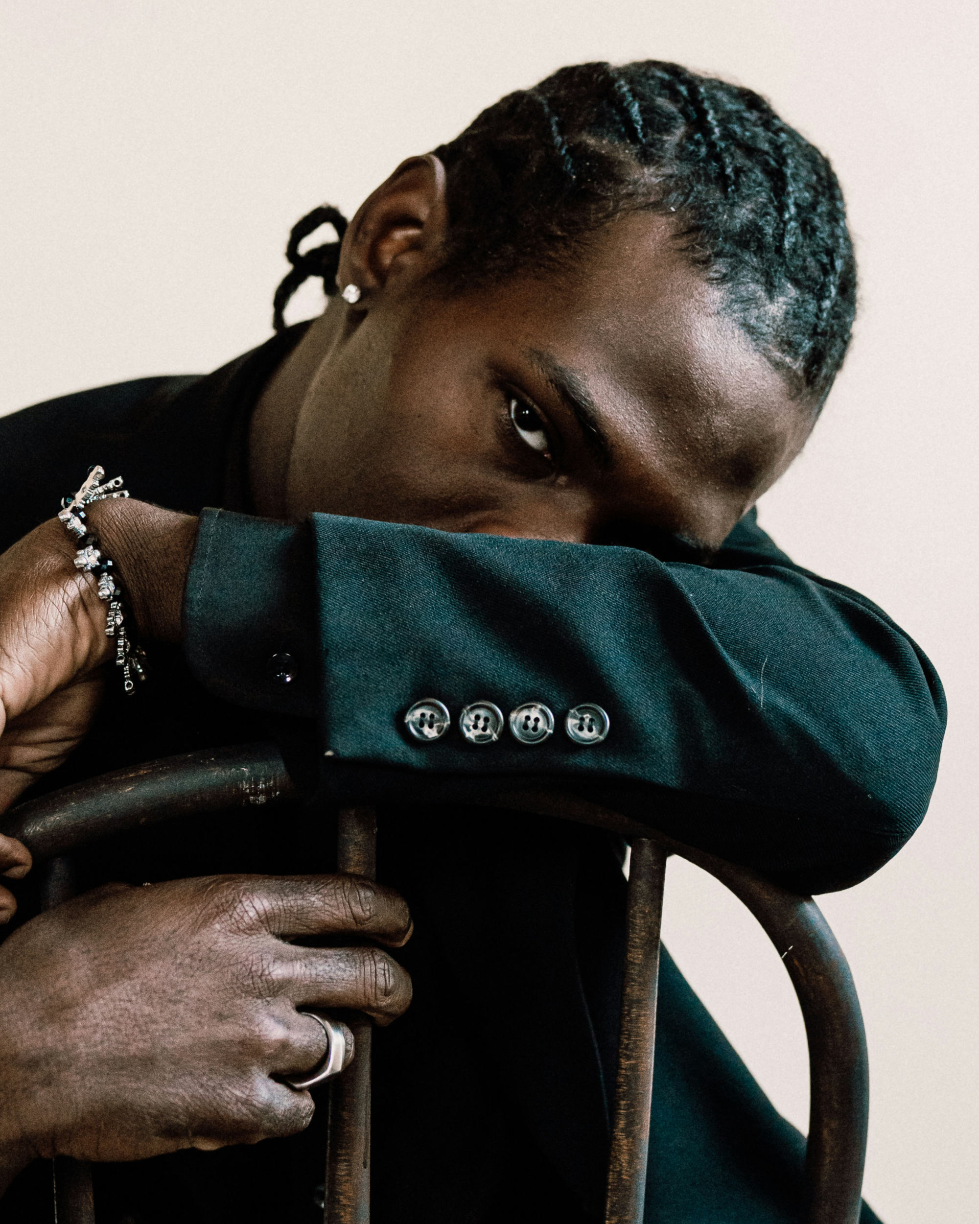 A portrait of a man sitting on a chair