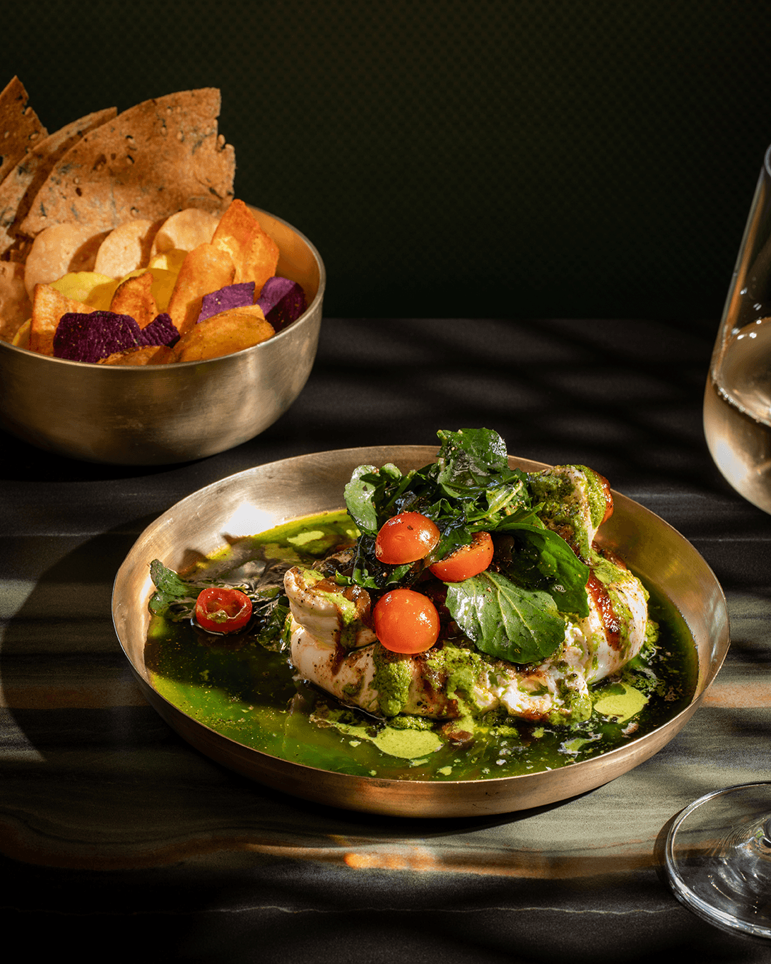 Terrace seating area with modern furniture and soft evening lighting.