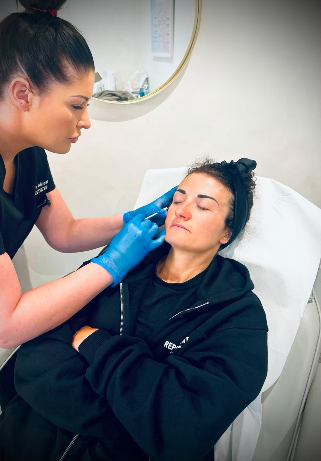 practitioner and client in aesthetic clinic