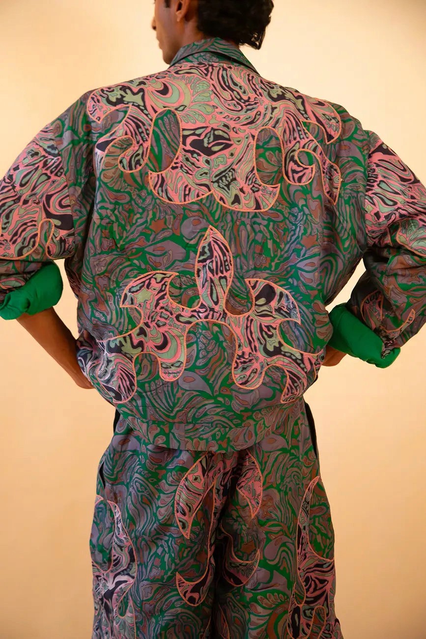 Unisex patchwork bomber and wide-leg pant set made from vintage textiles, featuring dragon motifs, green lining, and two-way zip