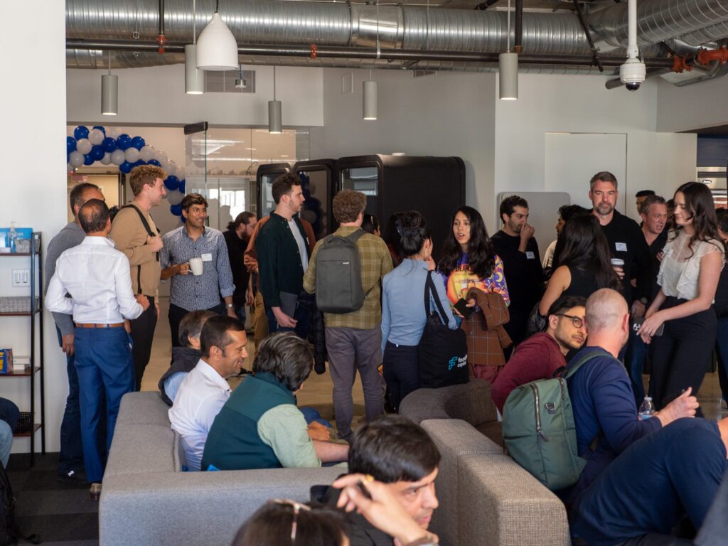 people gathering and conversing at the conference