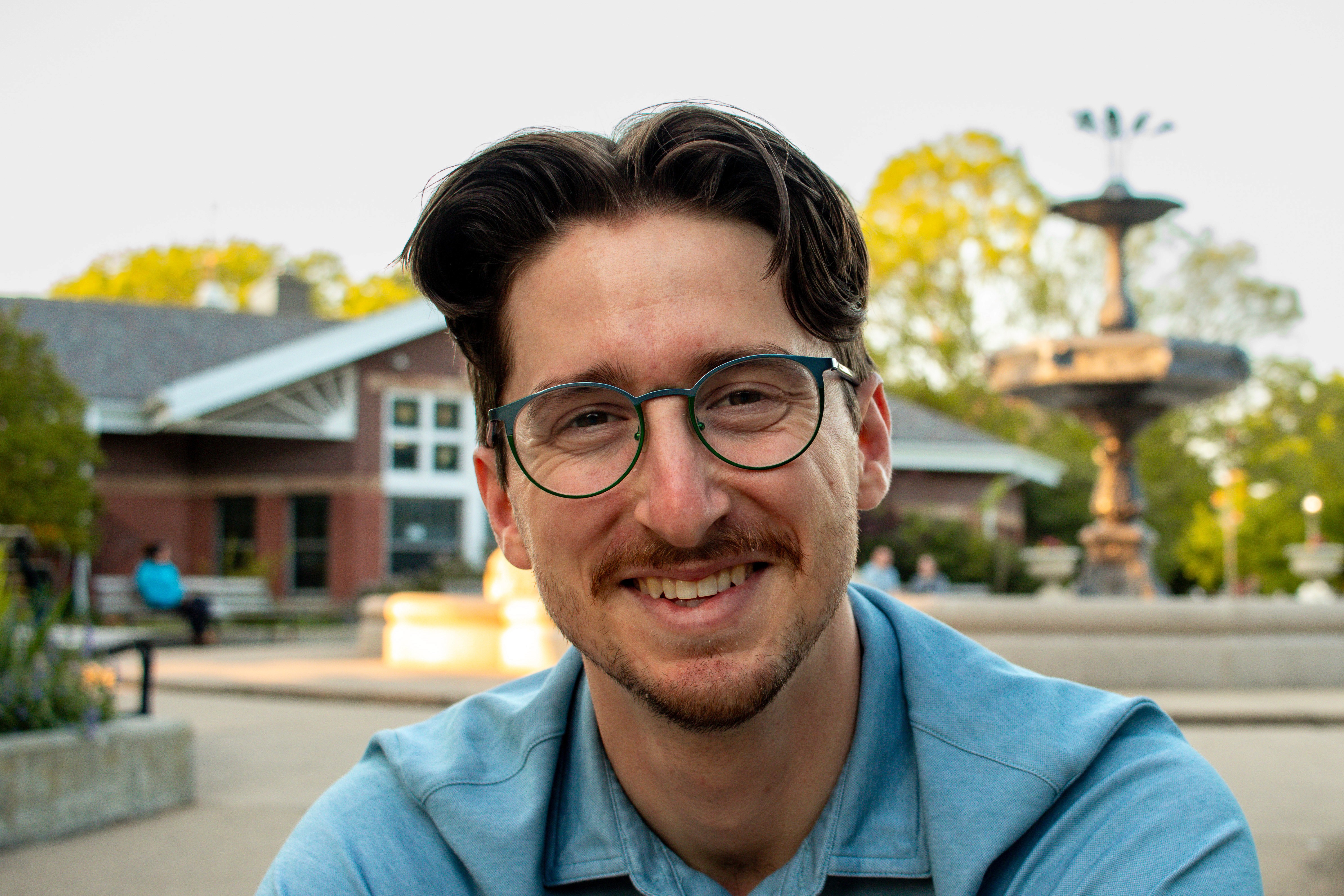 Chris Voirin, physical therapist and founder of Mindful Motion Physical Therapy, smiling outdoors in Oak Park.