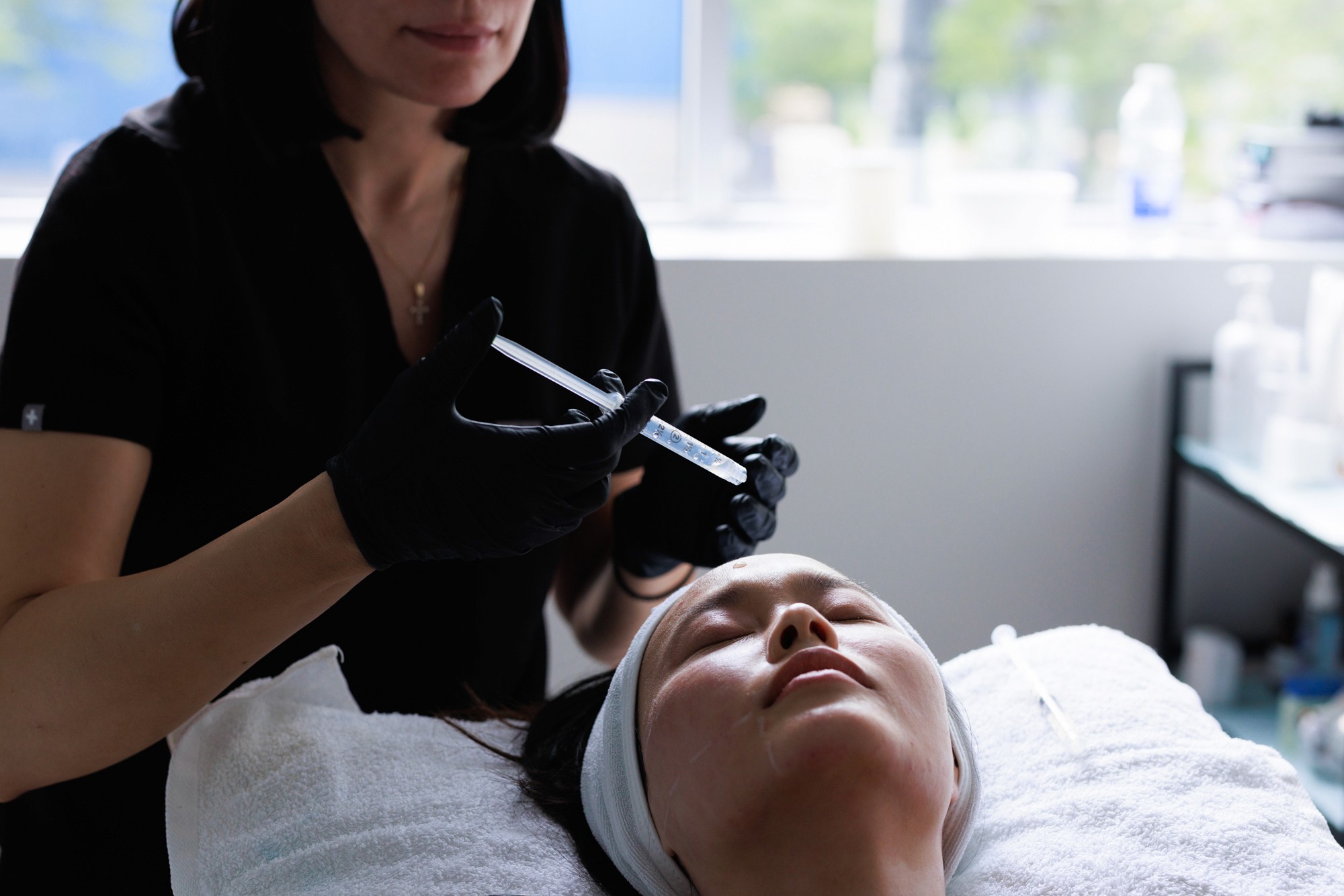 Patient receiving a microneedling treatment by our beautician