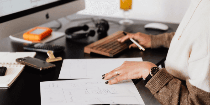 An entrepreneur analyses details about her business such as customer buying preferences