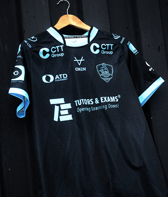 a red and yellow shirt on the grass