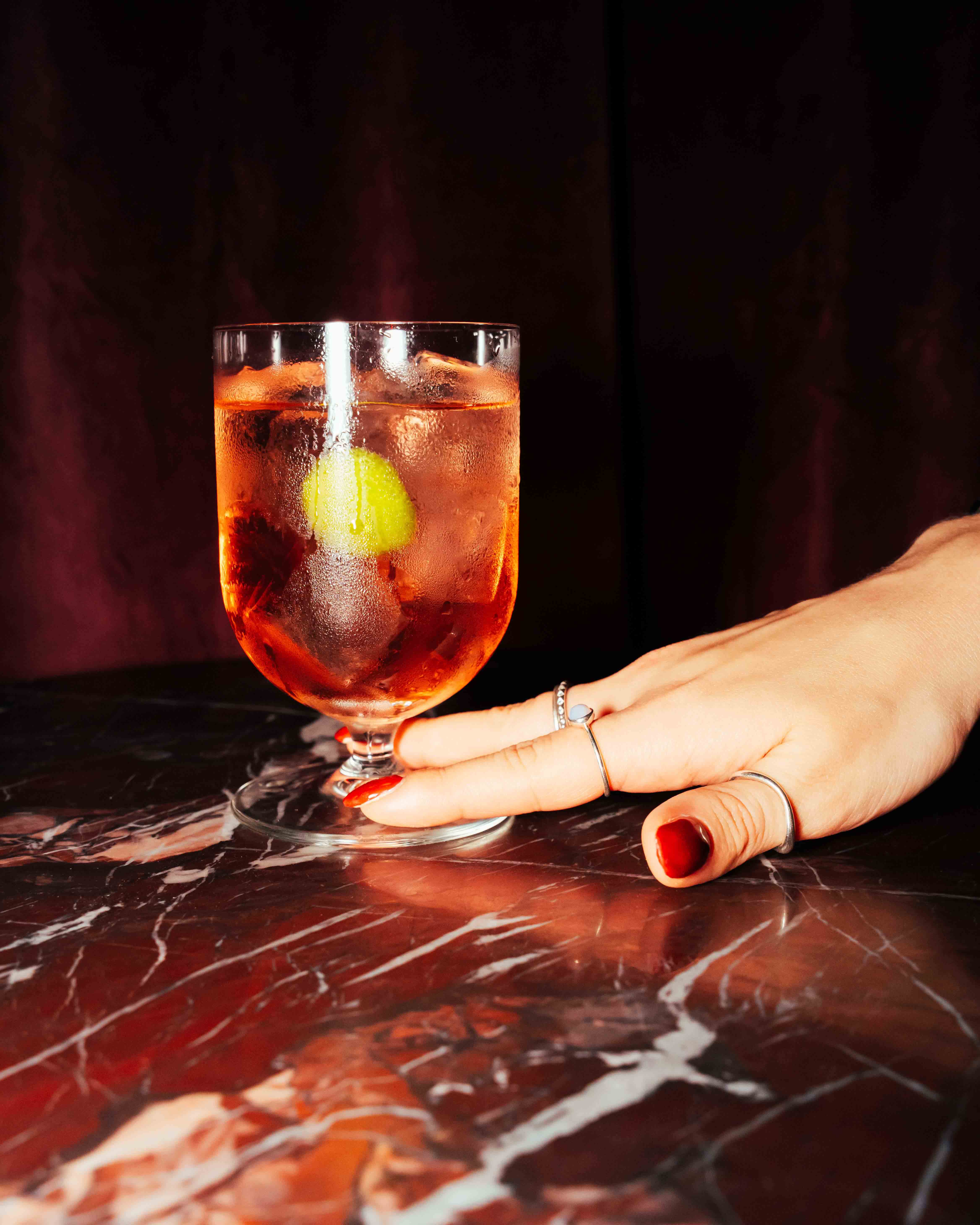 Bottles of olive standing on the marble counter
