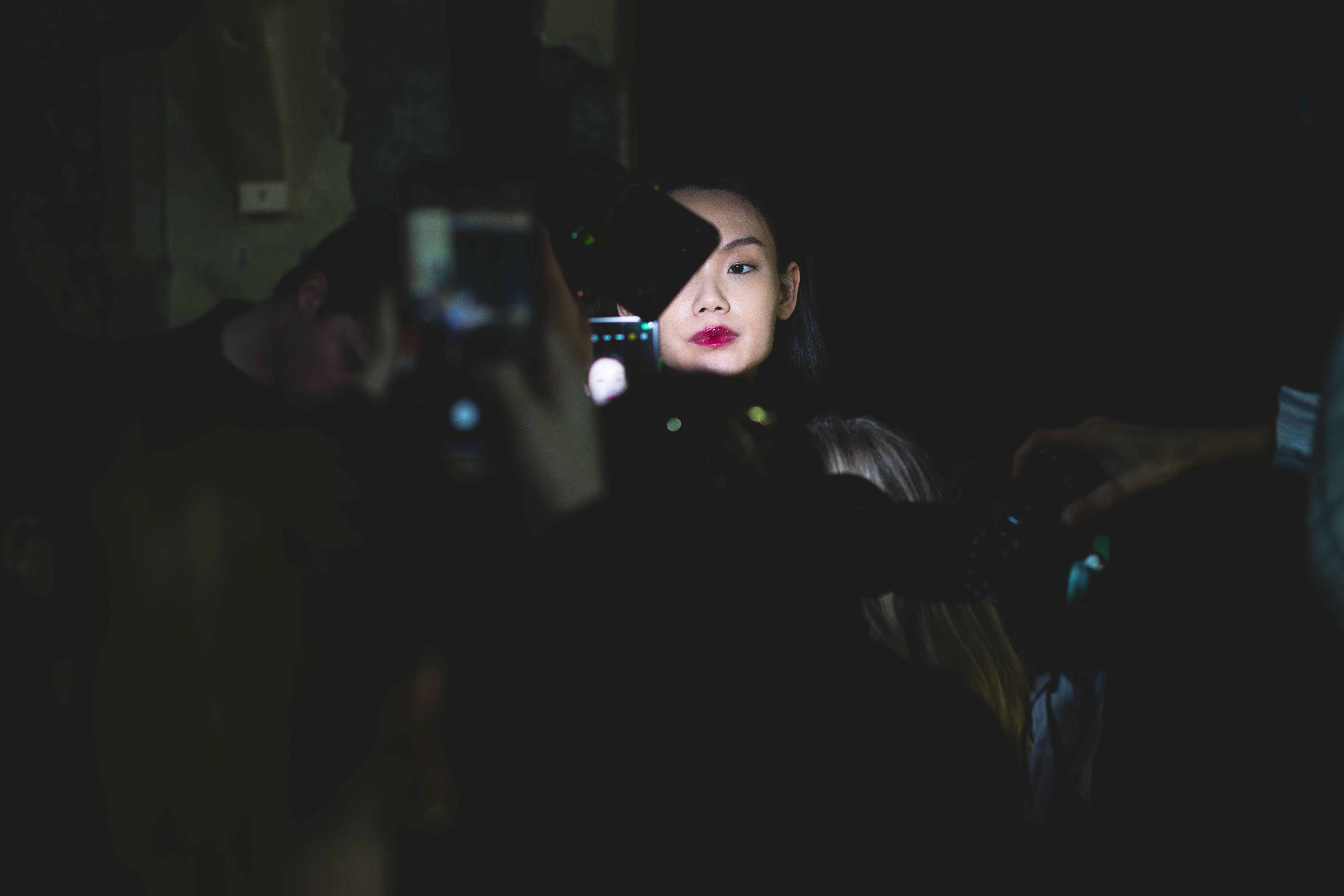 A black bottle on top, another black bottle