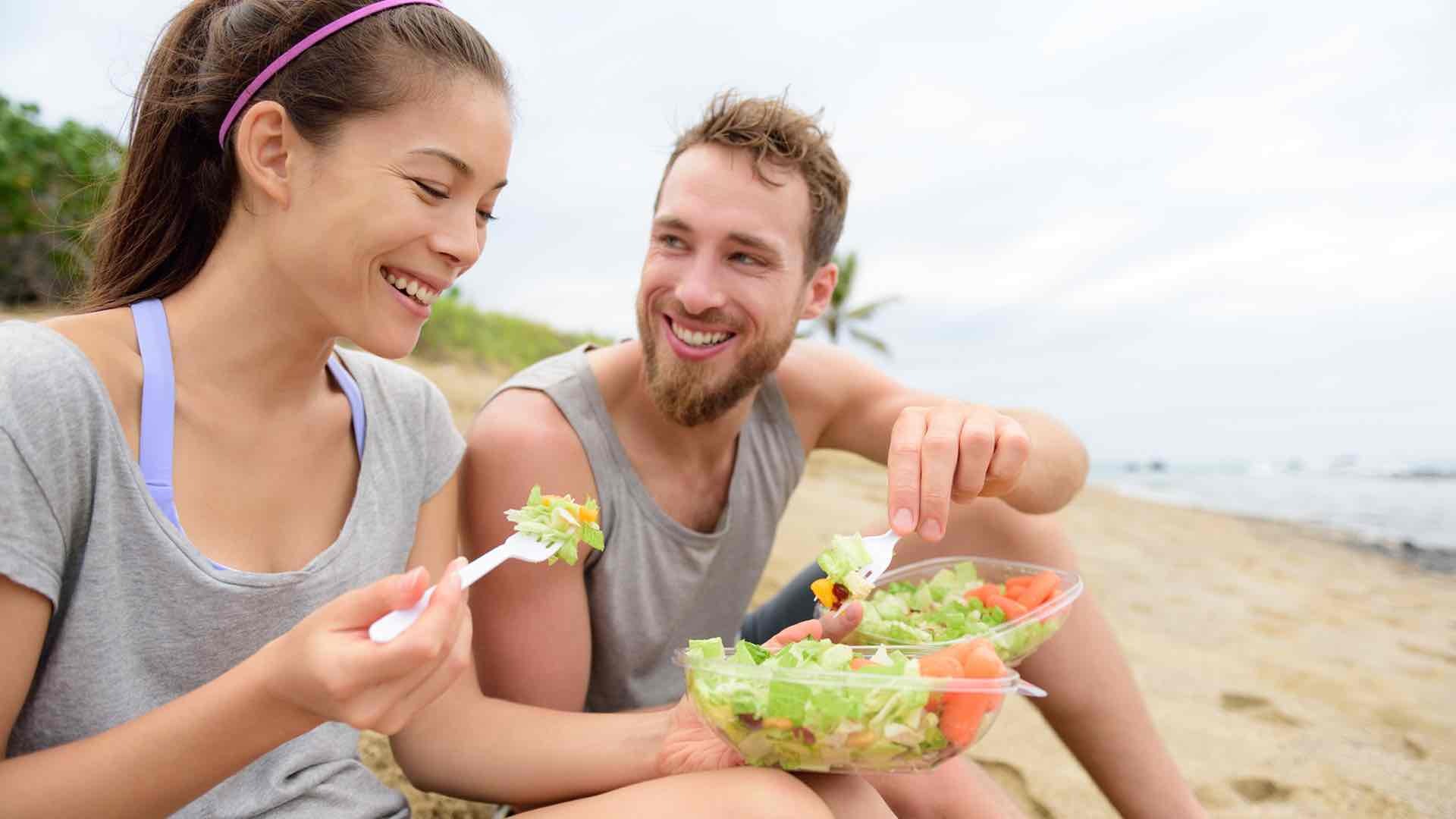 a couple eating salad