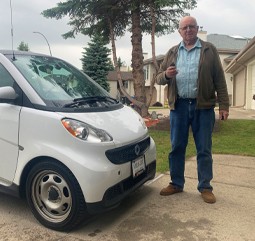 Happy customer holding new car key made for Smart ForTwo by CarKeyAction.