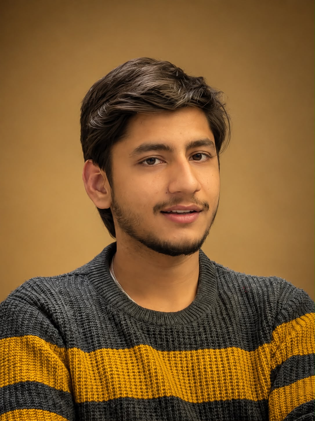 Young man with curly hair and beard