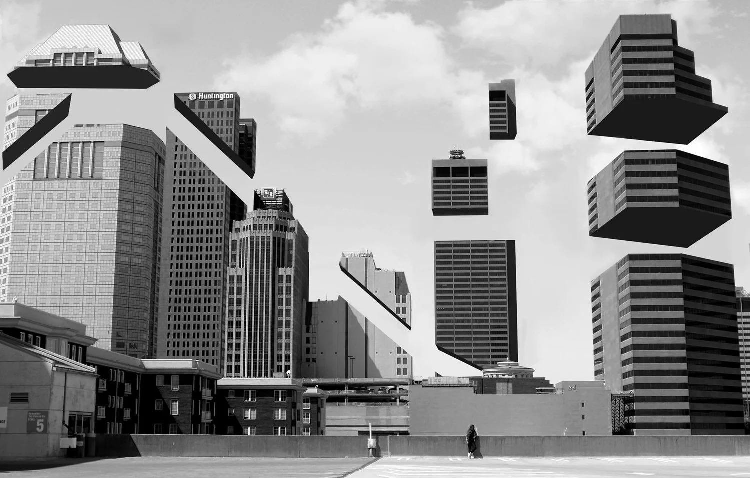A close-up of a hand wearing multiple decorative rings against a blue background.