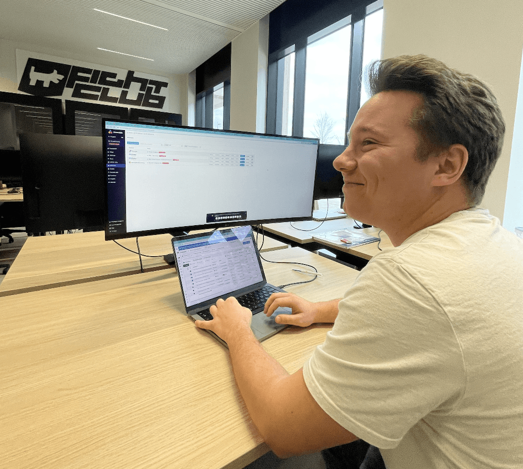 woman standing by wall holding mug