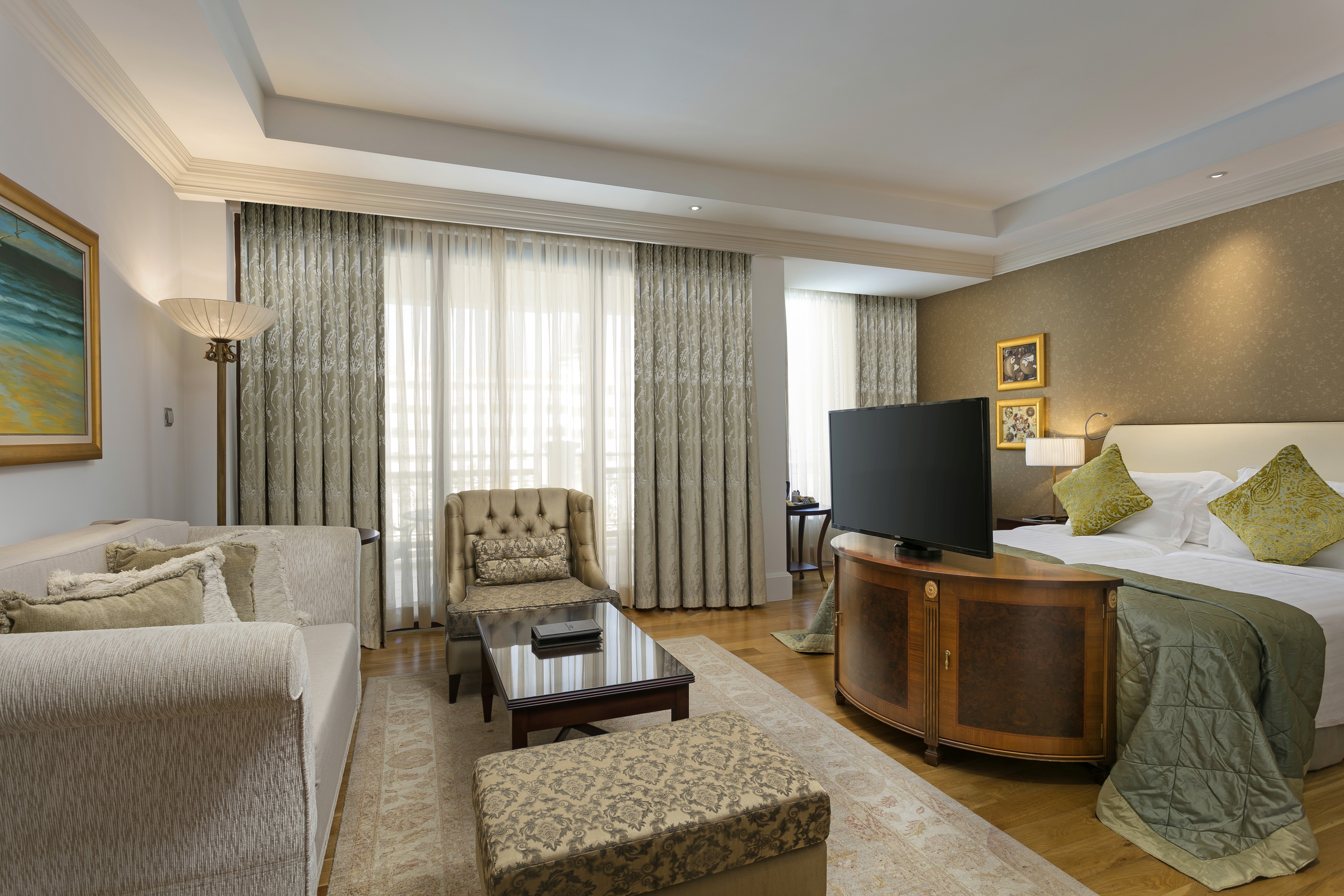 Comfortable seating area with elegant décor, flat-screen TV, and thoughtfully designed living space.