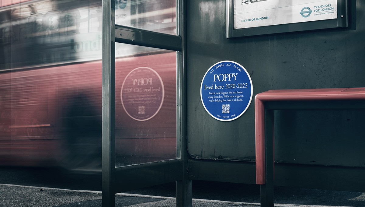 Blue plaque inside a bus stop
