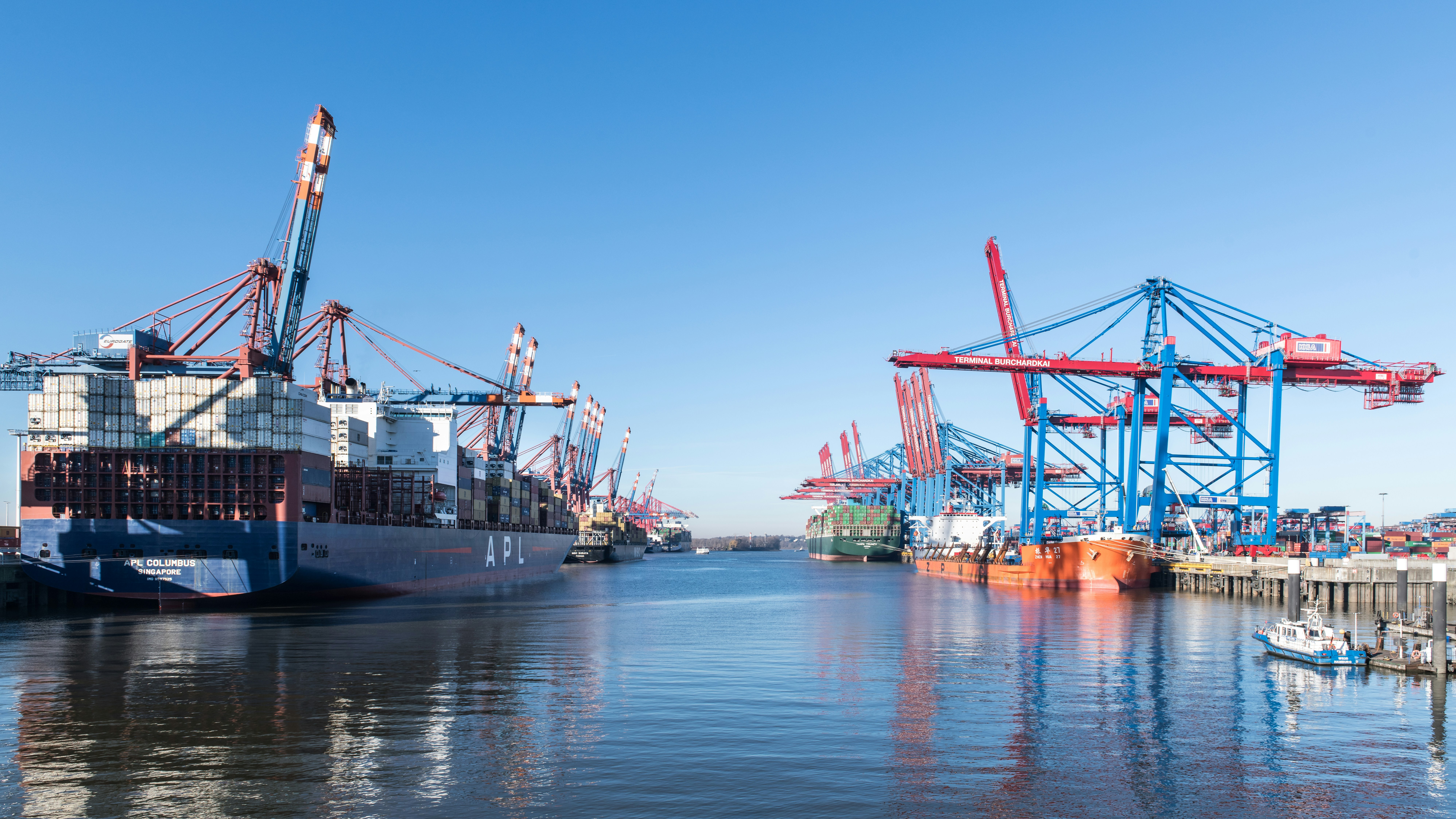 Container ships and cranes at a busy port
