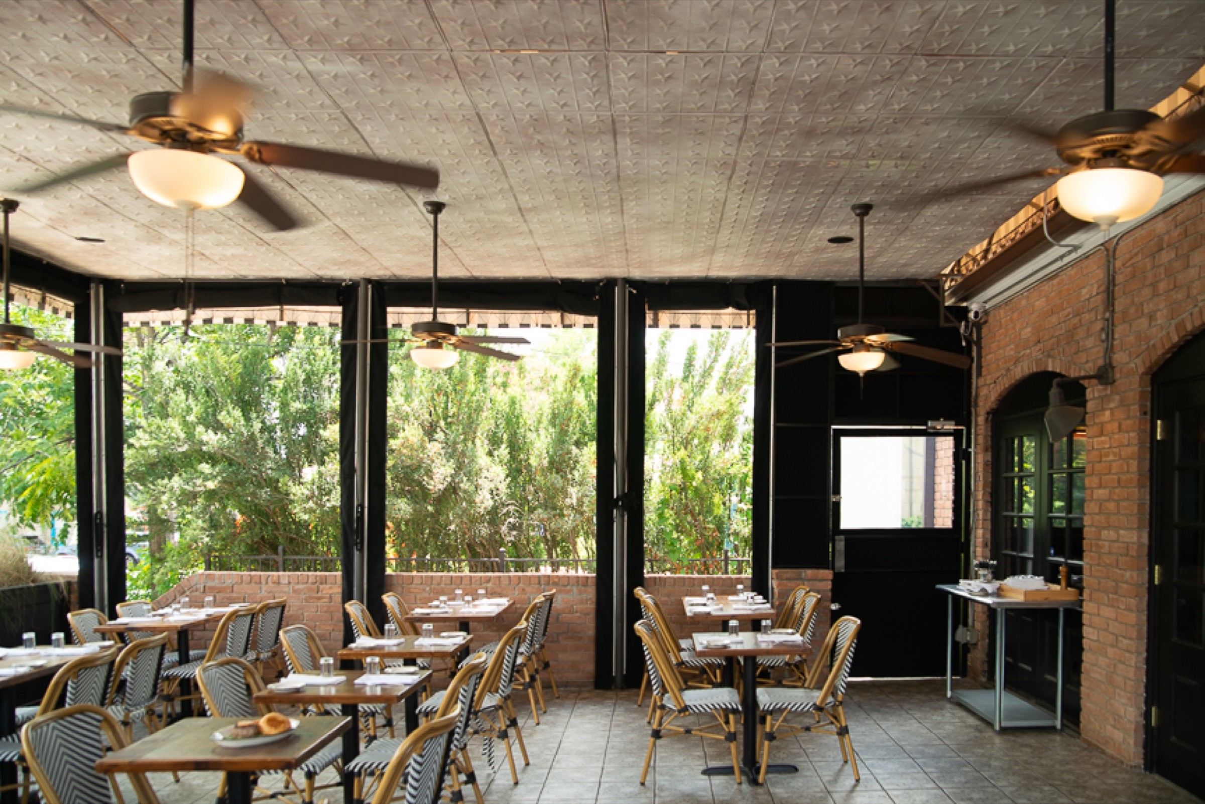 Bright restaurant patio and dining interior