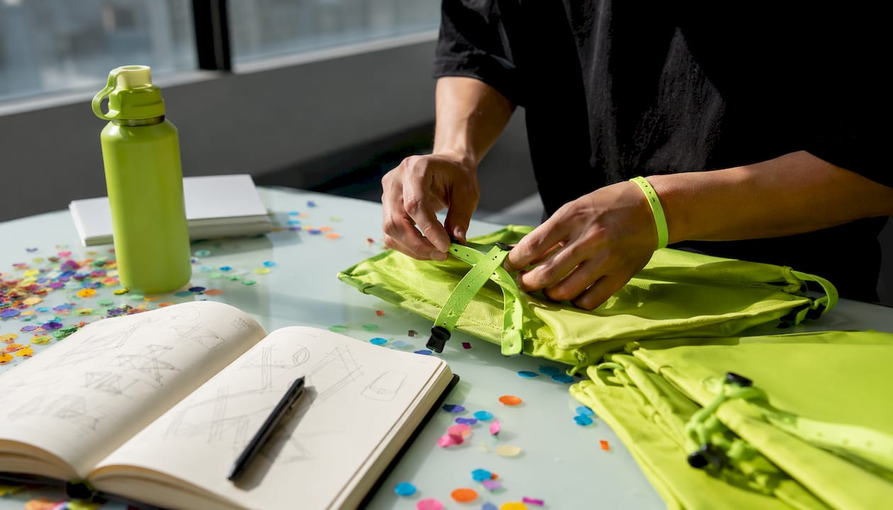 Hands preparing experiential event materials