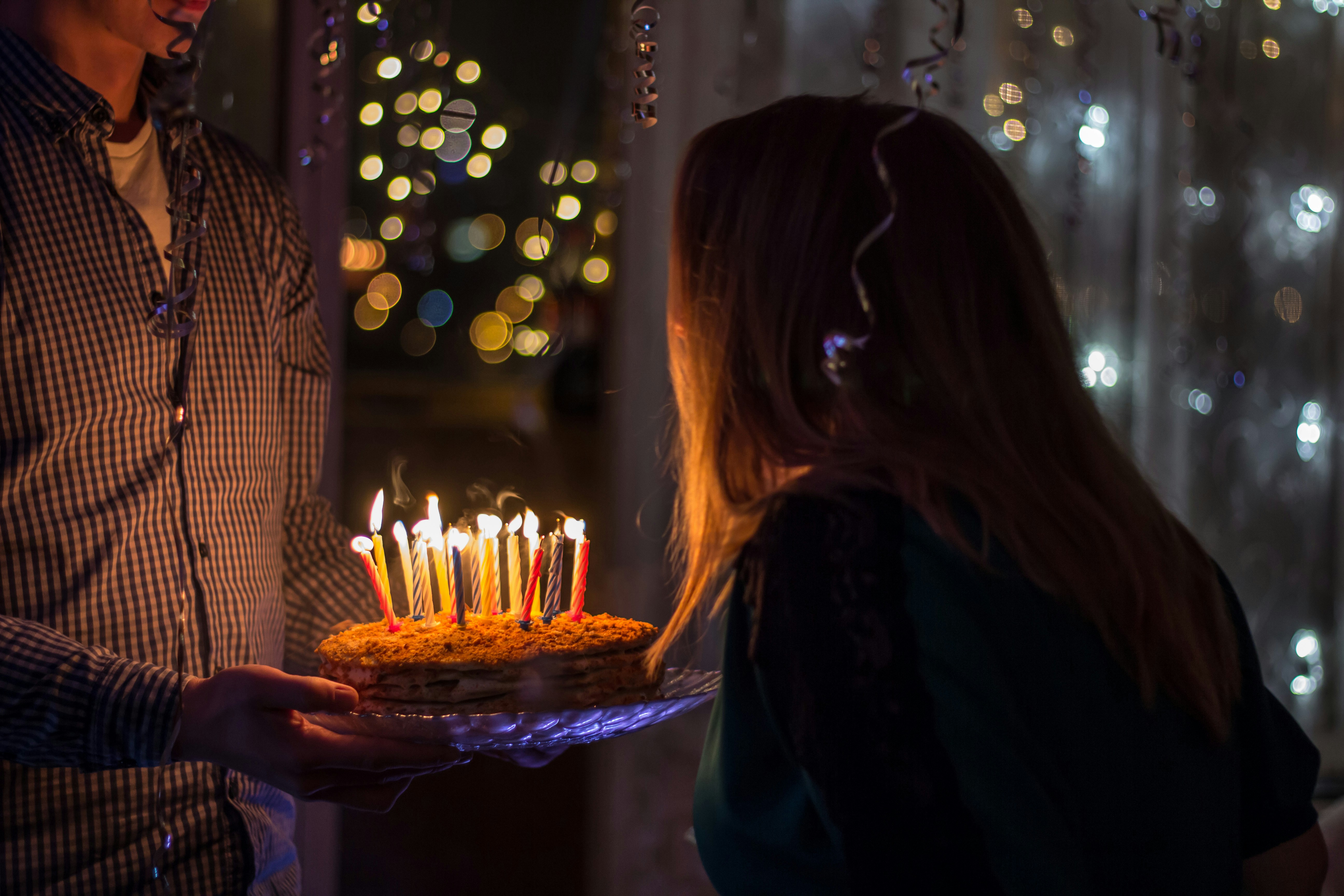 a white table with two candles and a book