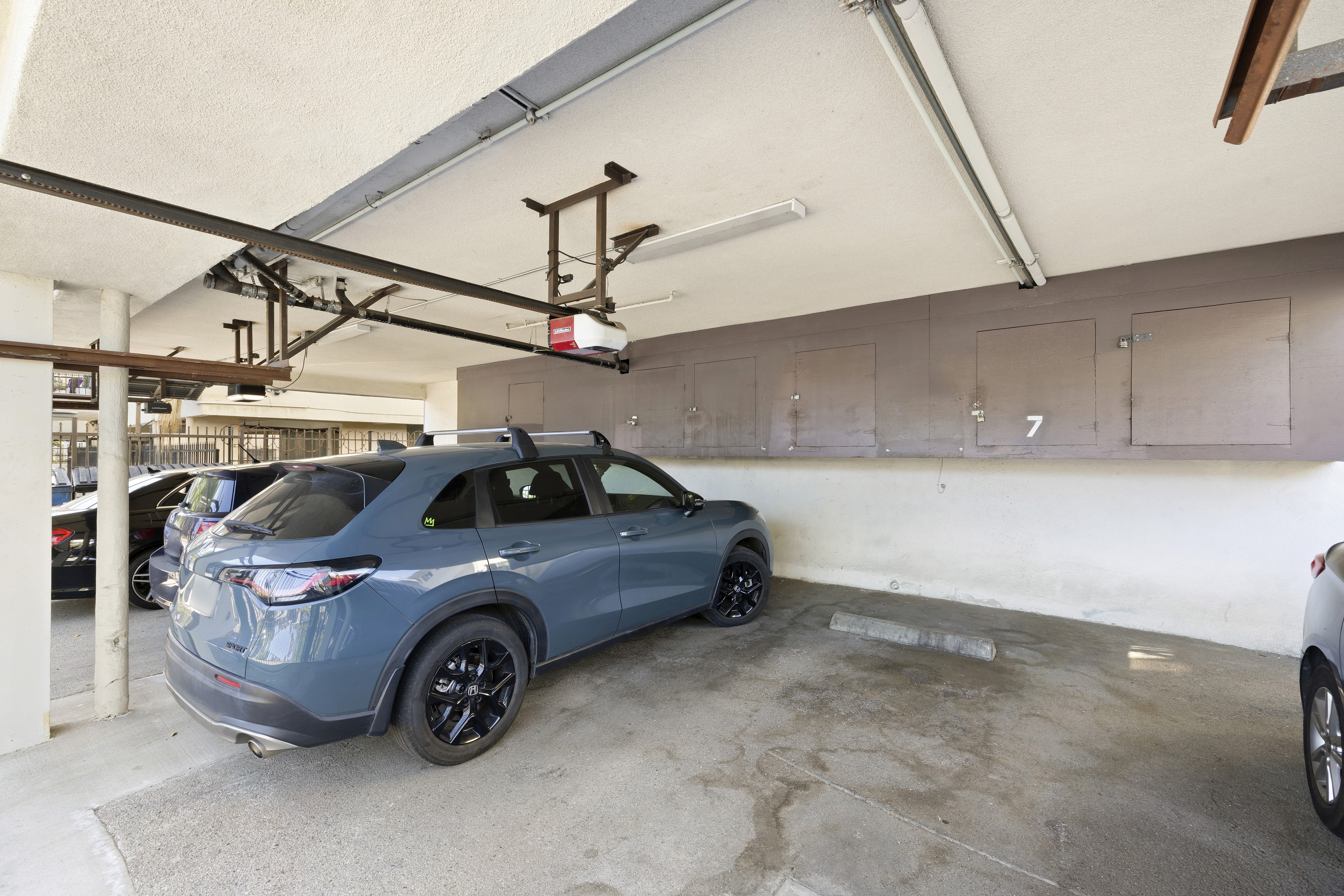 Covered parking space with storage cabinets and structural framing at 1336 N Citrus Ave.