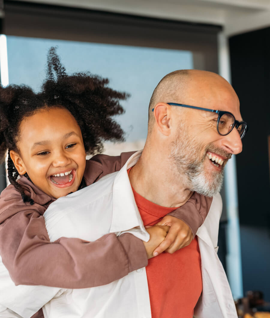 Man and daughter laughing.