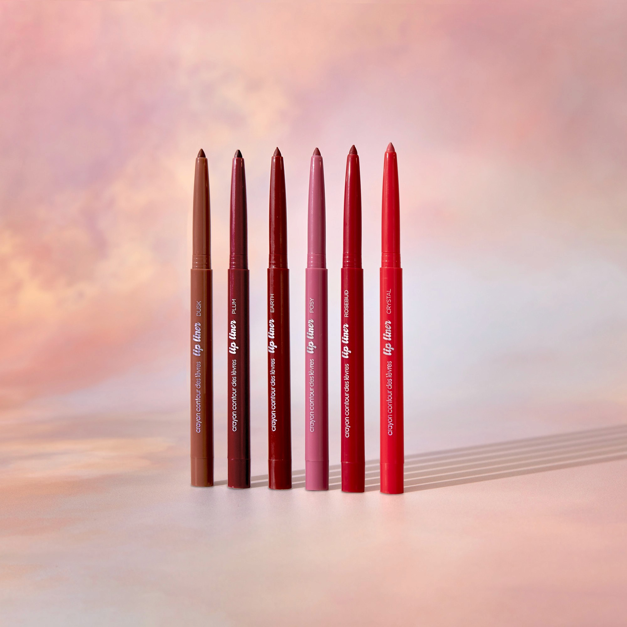 Minimalist beige bucket hat made of soft fabric, placed on a neutral surface with subtle shadow patterns