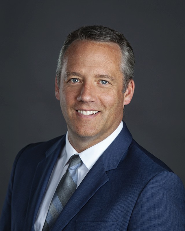 Kathleen filling the car with product to be reporpused