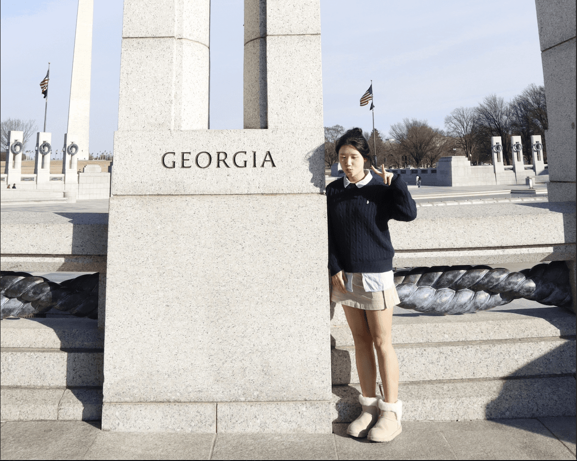 man in black and white striped long sleeve shirt taking photo of man in black shirt