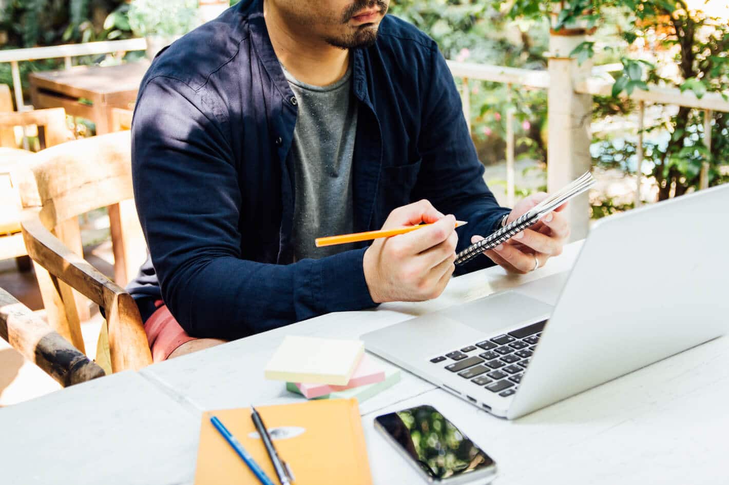 designer in blue shirt graphic creative checking message box and working on digital laptop copy space for use