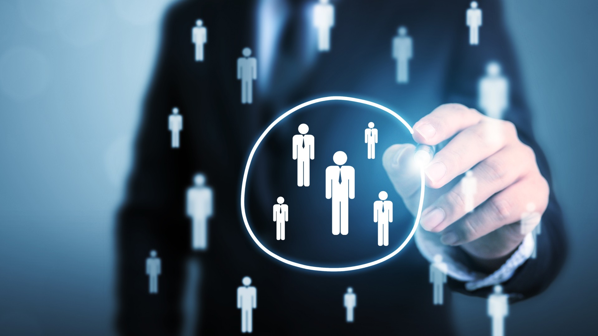 Business professional highlighting a selected group of individuals in a digital interface, representing how PEPs, SIPs and RCAs are identified and categorised in AML compliance screening.