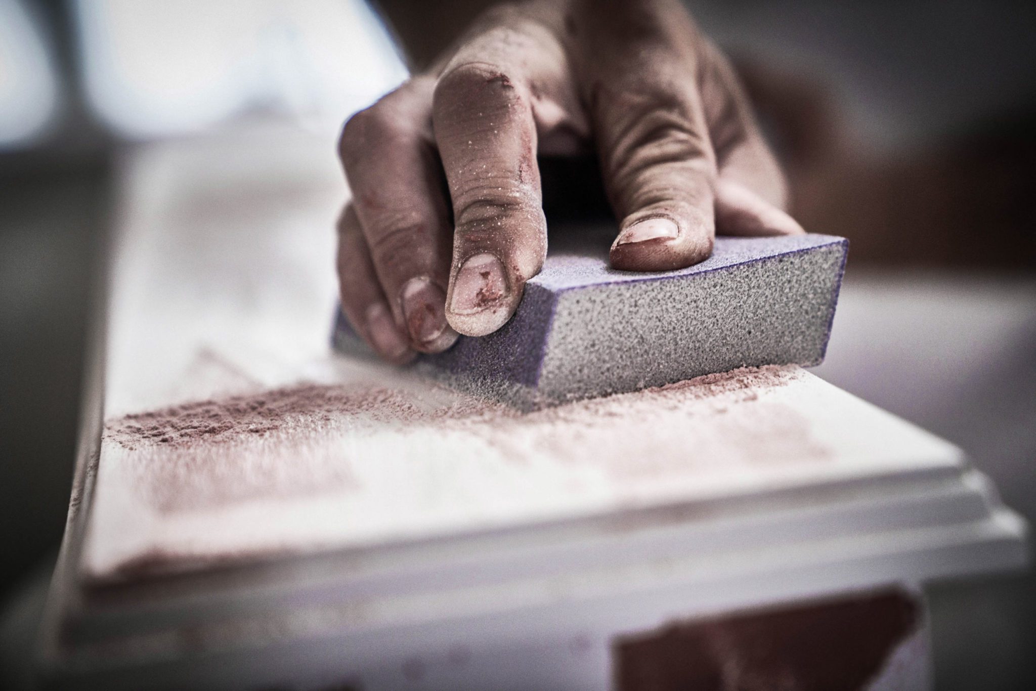 Person sanding lumber