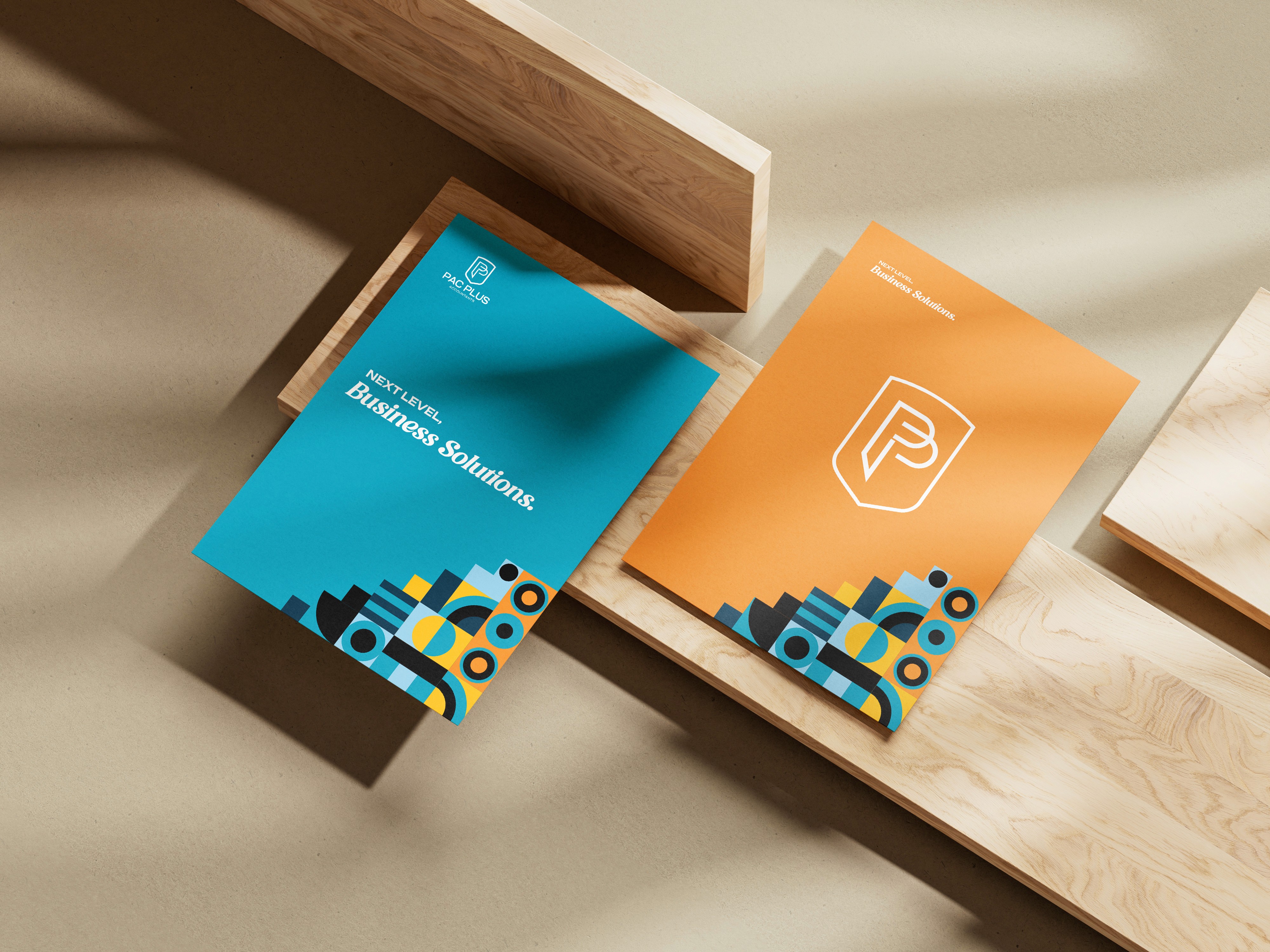 White branded cap with turquoise logo placed on fresh lemons in a red bowl