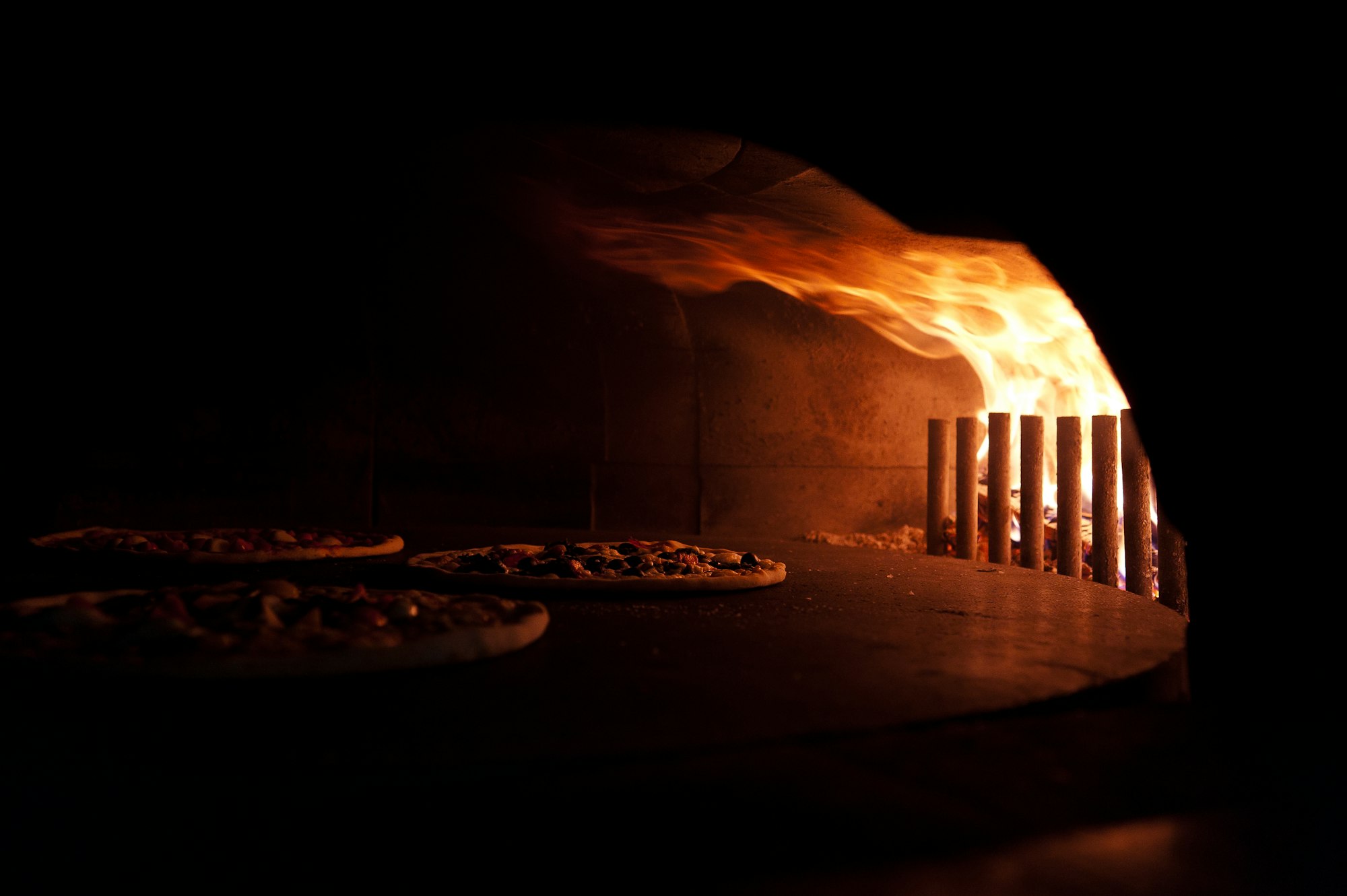 The wood oven, lit before dawn