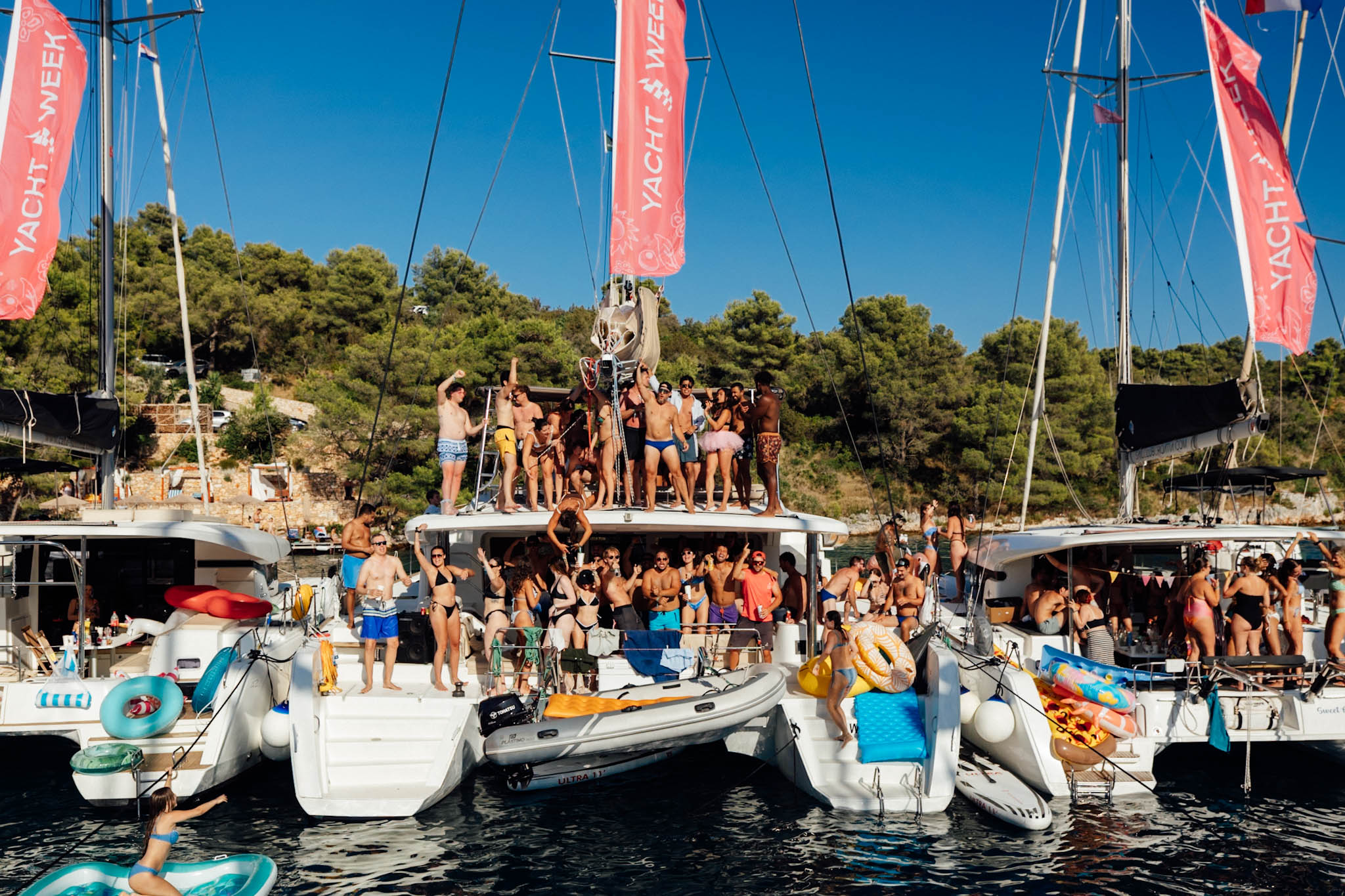 sailing yacht catamaran full of people partying during yacht week 2025 in croatia