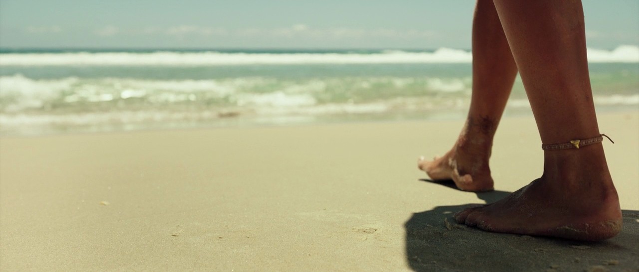 black laptop computer on brown wooden stand