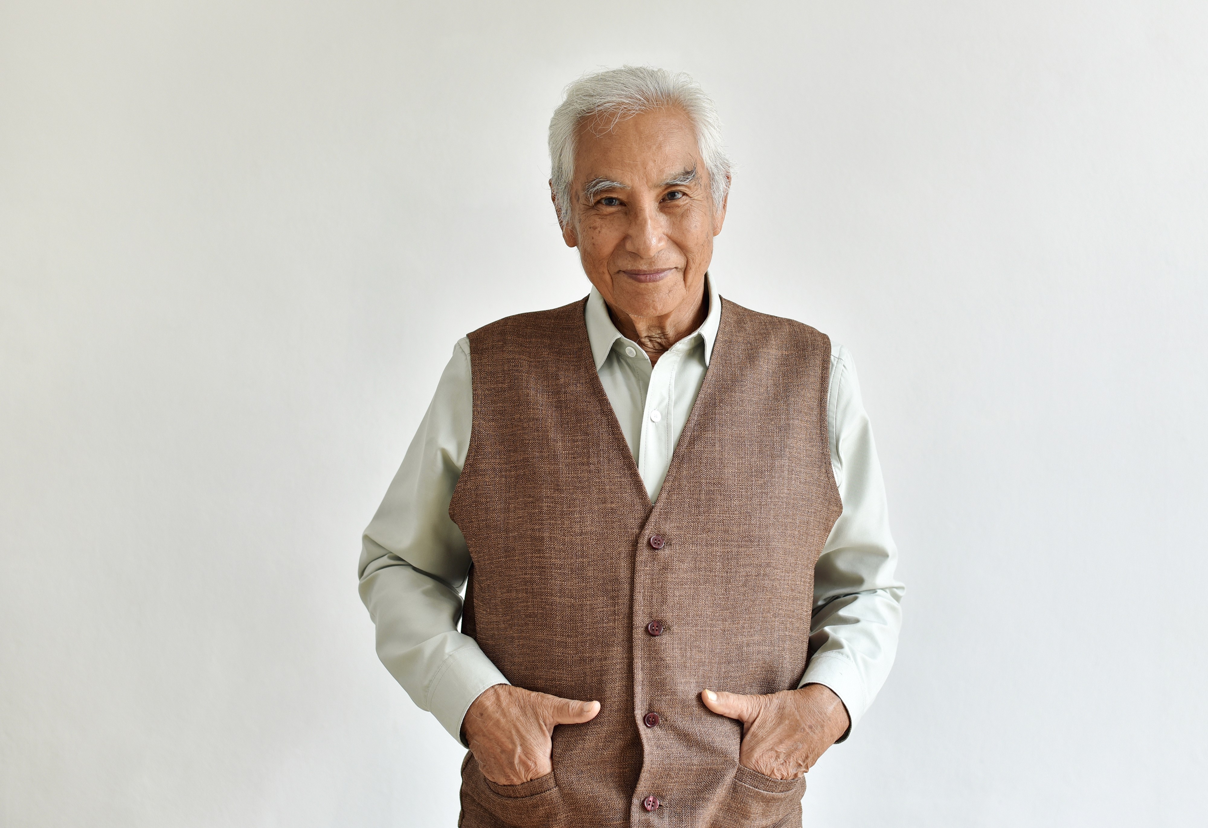 Streetside billboard with flyposters of the Batch.Works brand and illustrations