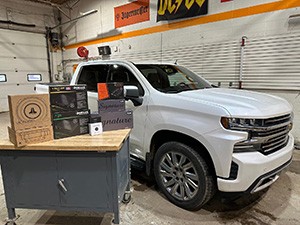 A person stands in a sandstone cave.