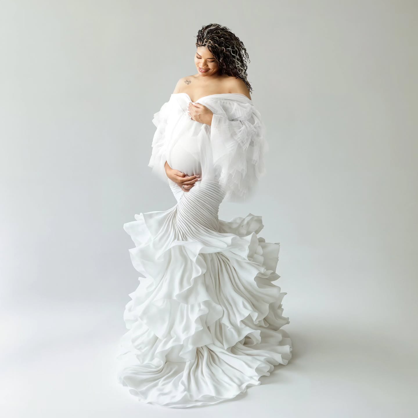 Elegant pregnancy photoshoot of a glowing mother-to-be by Mahvin Photography in Dubai, celebrating the journey of pregnancy.