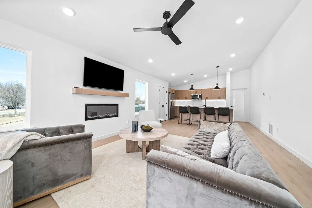 A luxury interior of a apartment building with many furnitures and windows