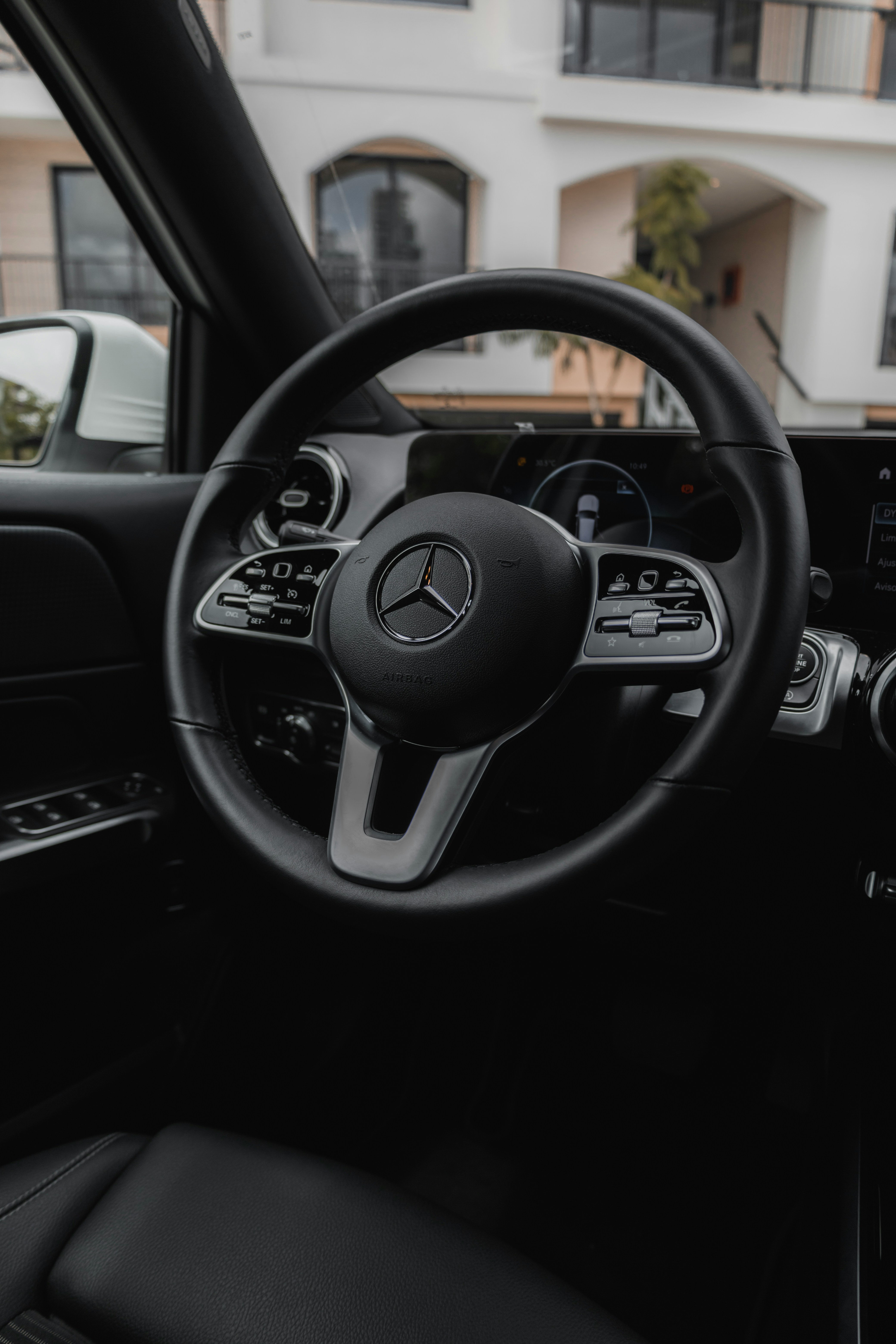 the steering wheel and dashboard of a car
