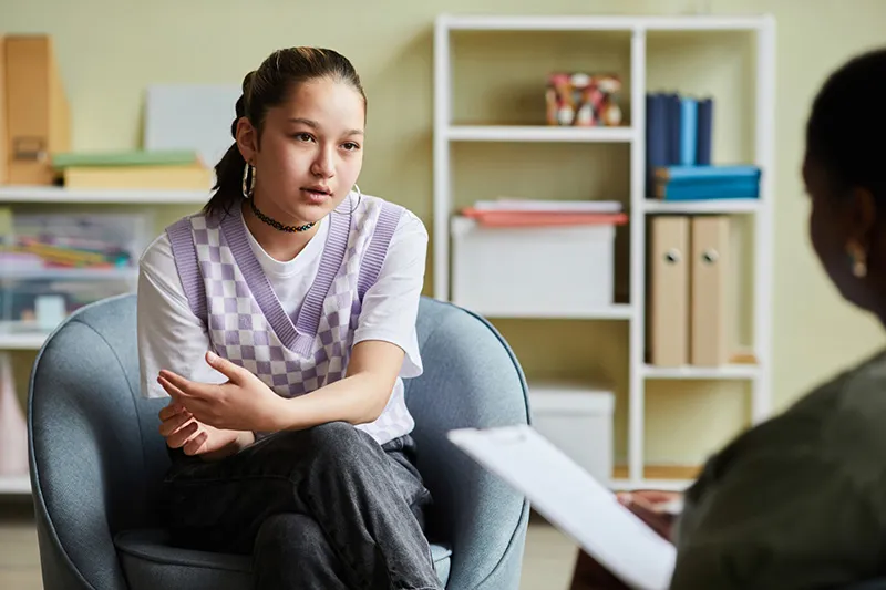 teen counseling appointment with therapist supporting adolescent mental health