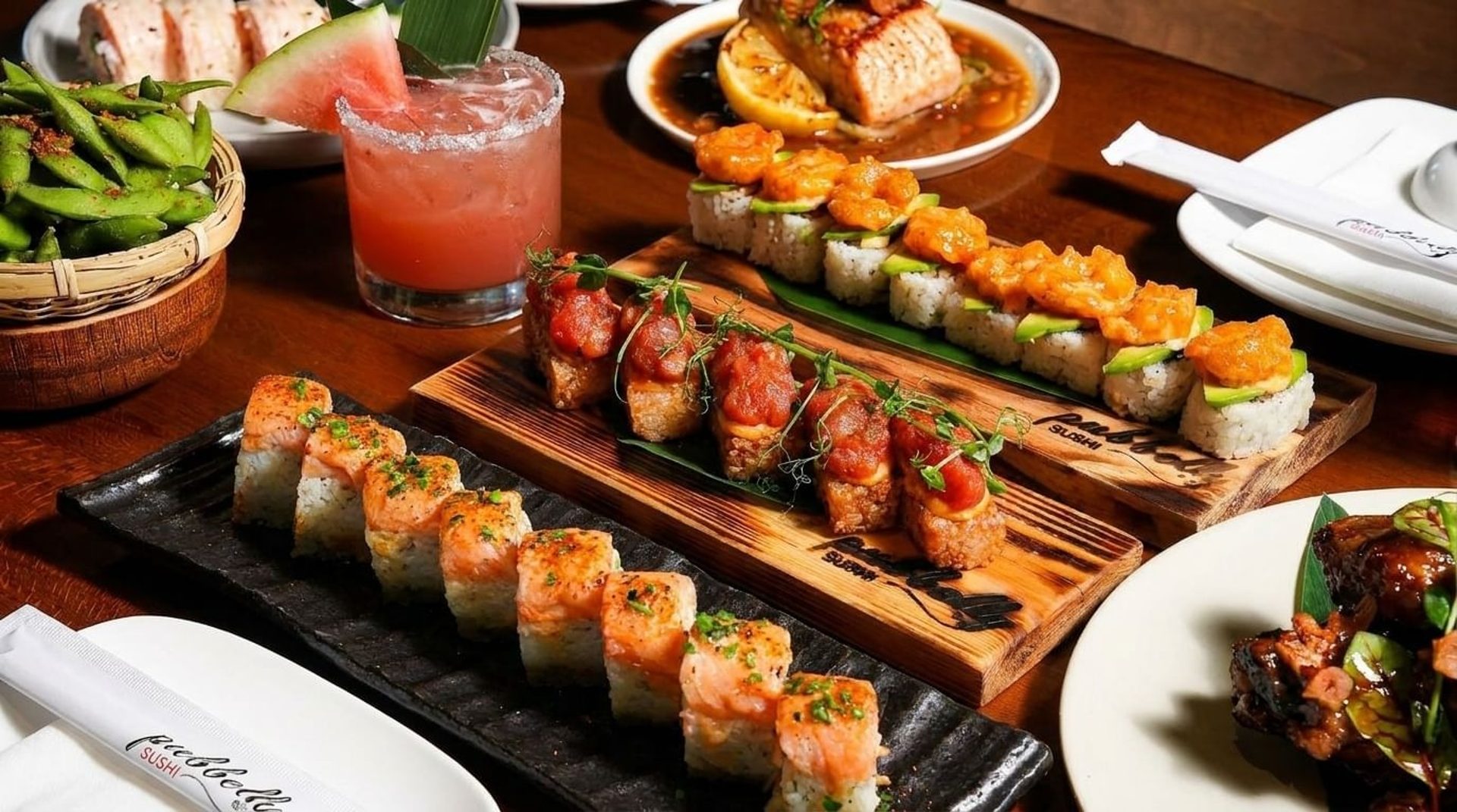 Sushi spread and watermelon margarita