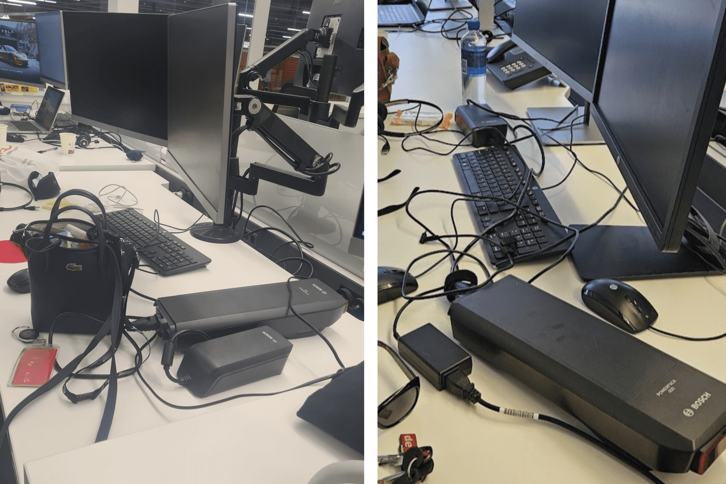Two e-bike batteries charging on office desks, beside keyboards, cables and a handbag.