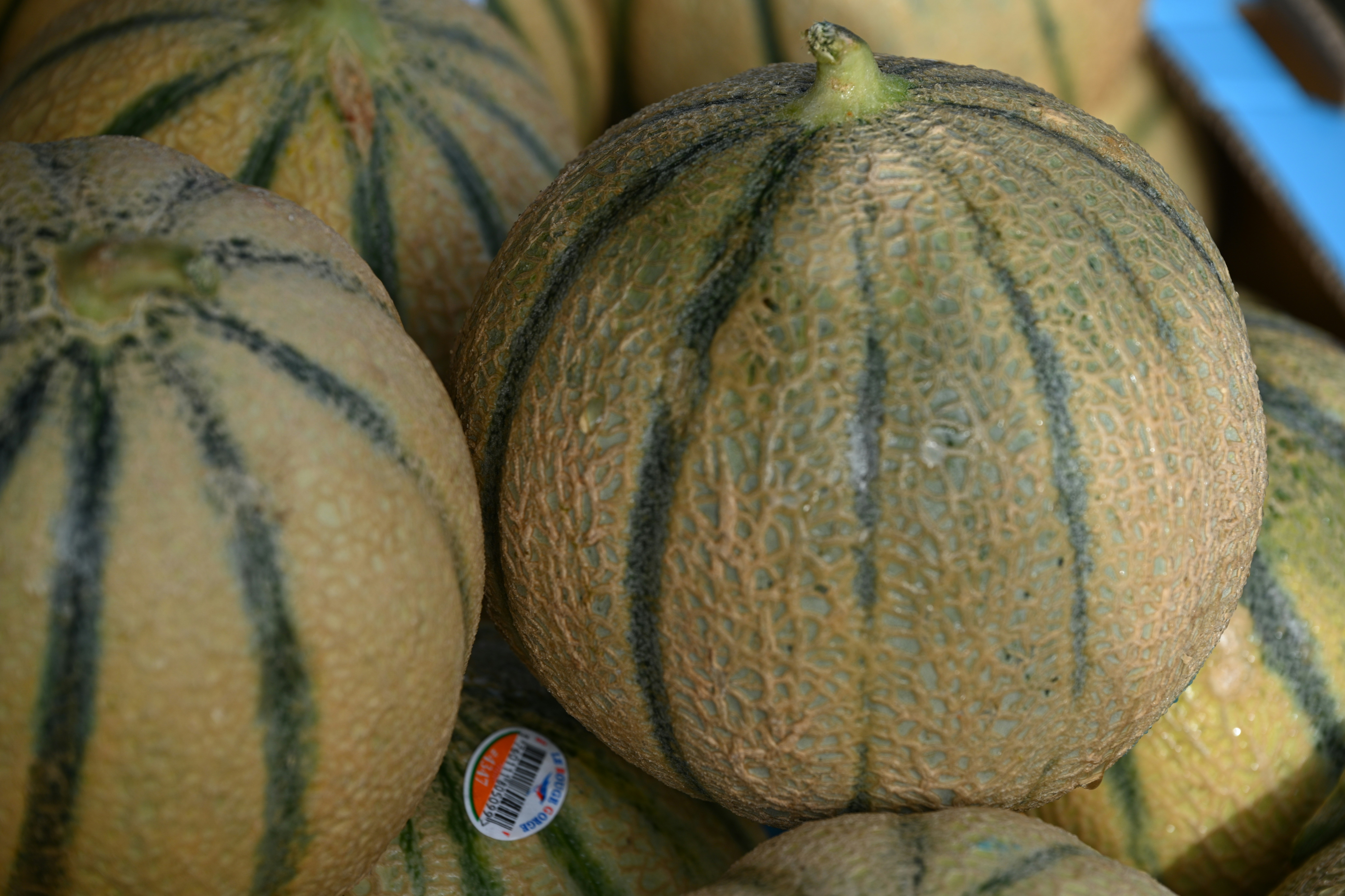 a pile of watermelons sitting on top of each other