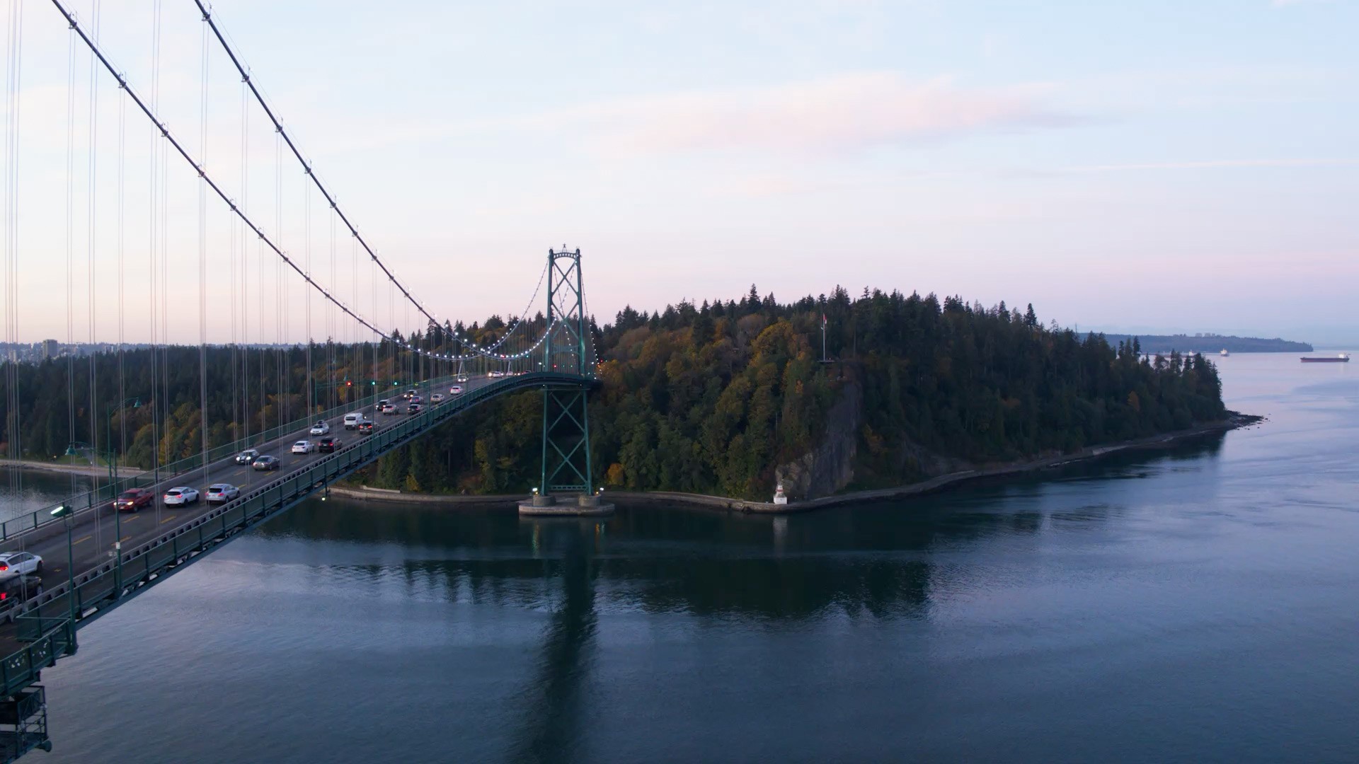 Photo of a metal bridge across an urban river