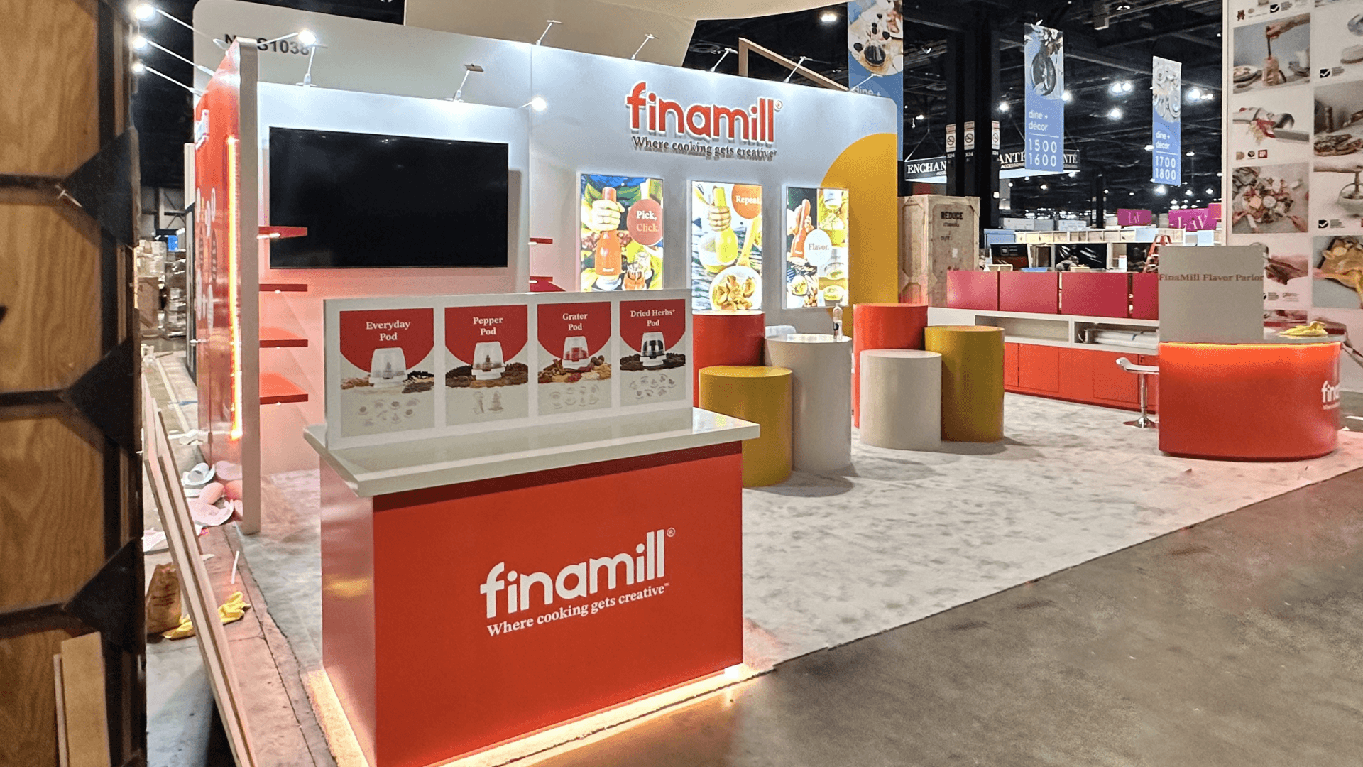 20x20 food and beverage booth at Las Vegas Convention Center with product shelving, branded header, and tasting counter